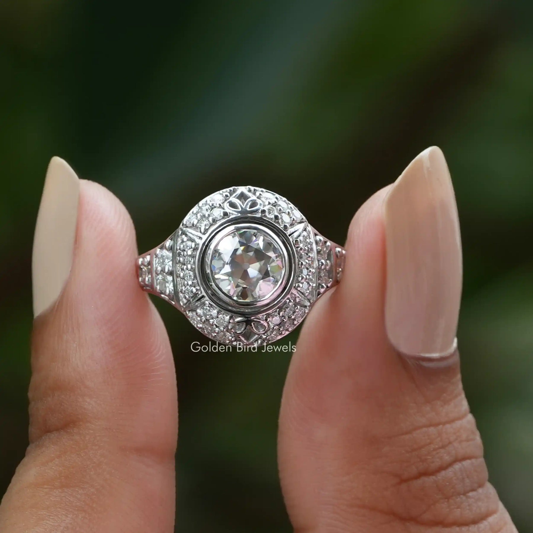Front View of Old European Round Cut Moissanite Ring In two Fingers
