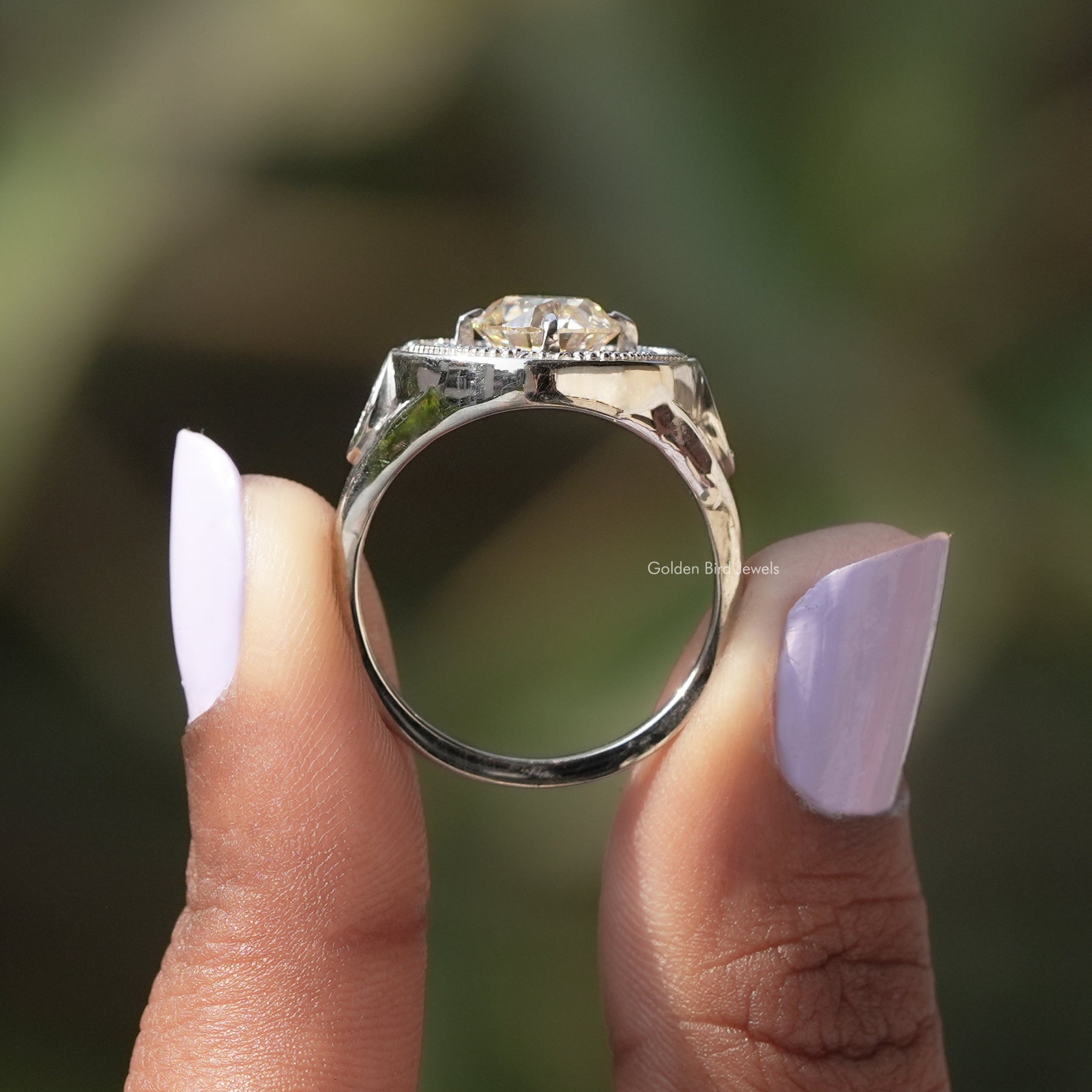 Back View of Old European And Tapper Baguette Moissanite Ring In two fingers