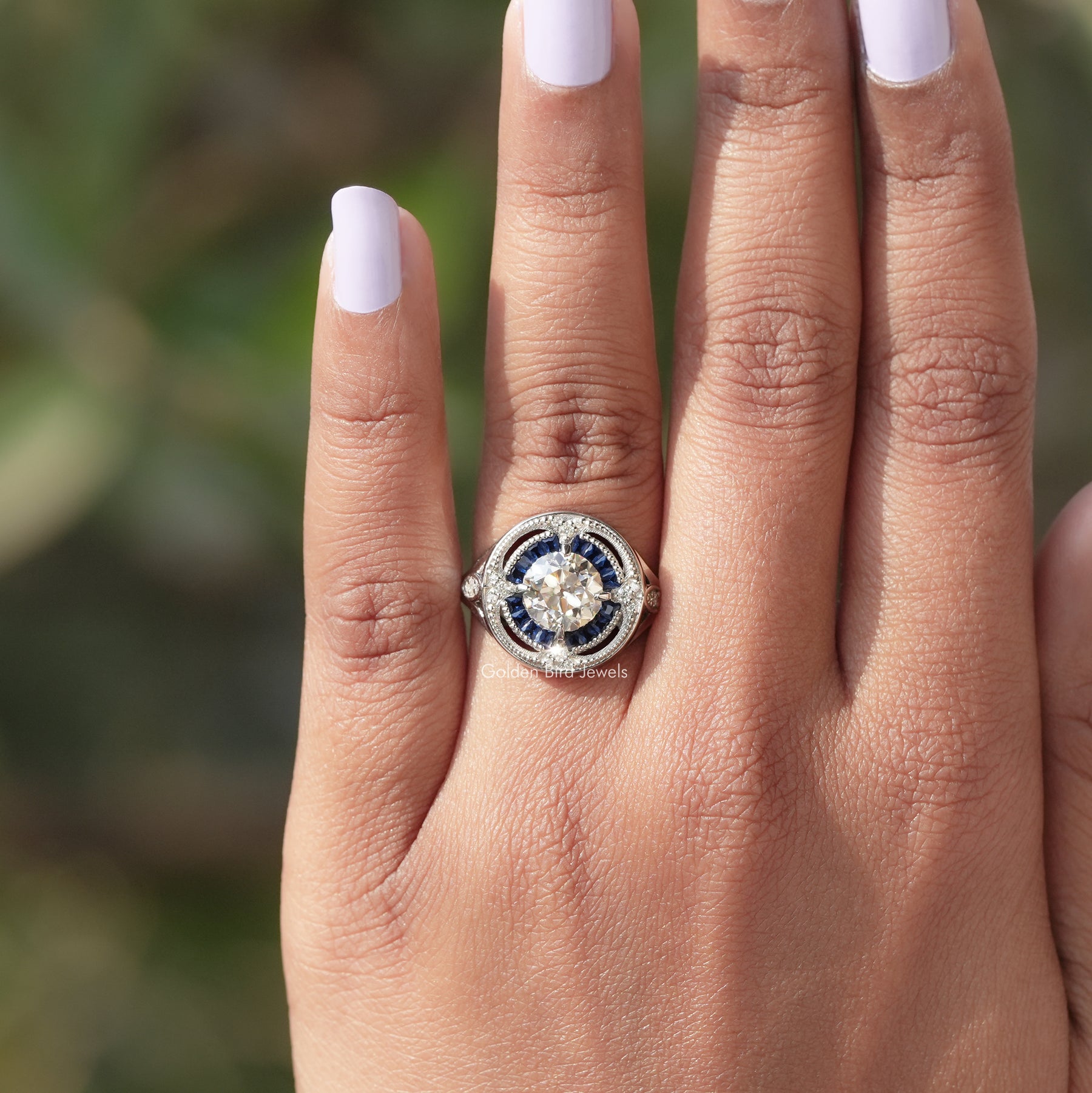 View of Round Cut And Tapper Baguette Halo Ring In finger