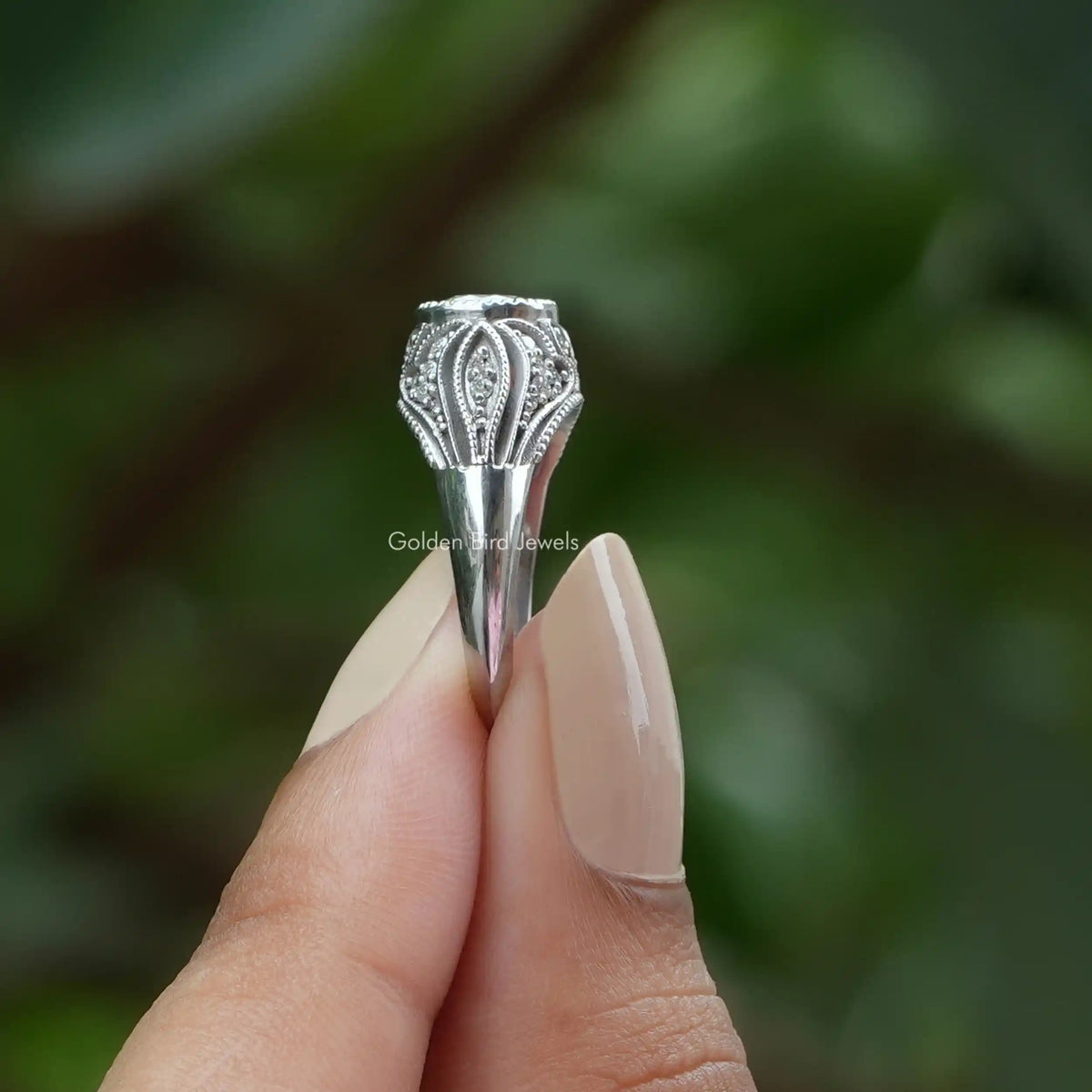 Side View of Old European Round Cut Moissanite Ring In two fingers