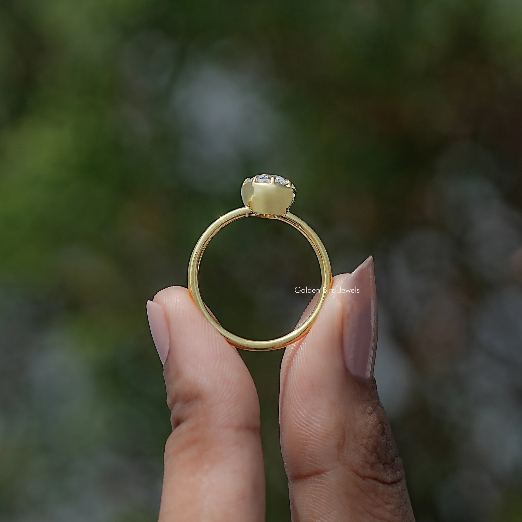 Back view of European Cut Moissanite Solitaire Ring in secure setting