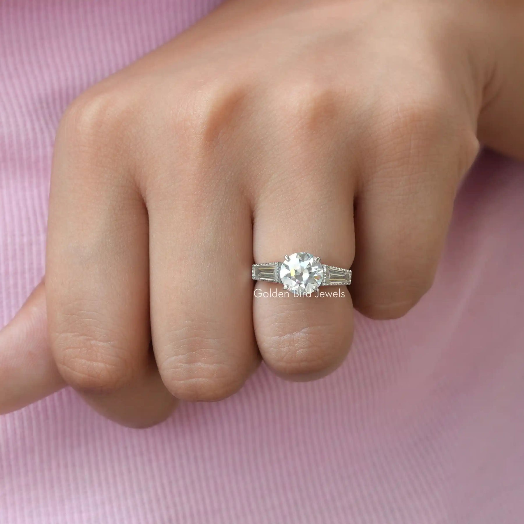 View of Round Cut Three Stone Moissanite Ring In Finger
