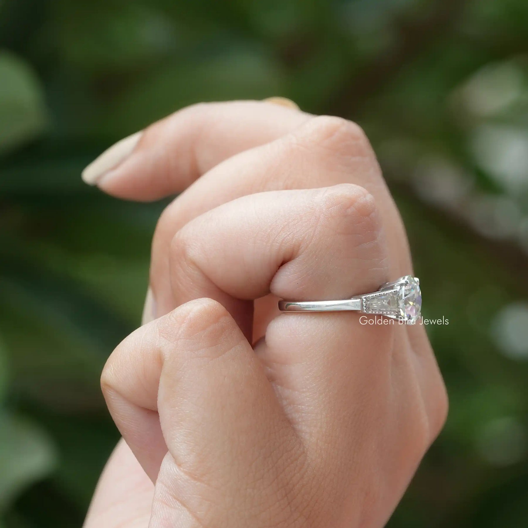 View of Moissanite Old European Round Cut Engagement Ring In Finger