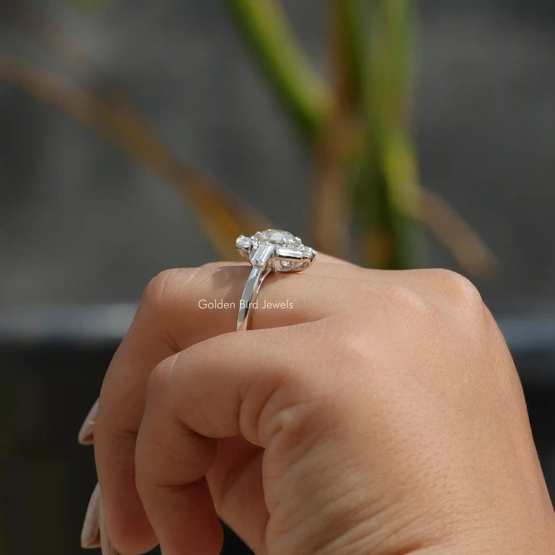 Round and Baguette Cut Moissanite Halo Engagement Ring In Finger