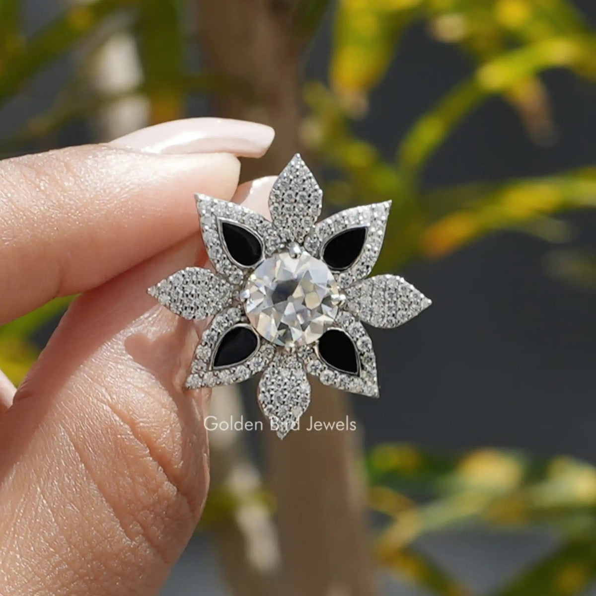 Front View of Old European Round Cut Floral Moissanite Ring In two Fingers