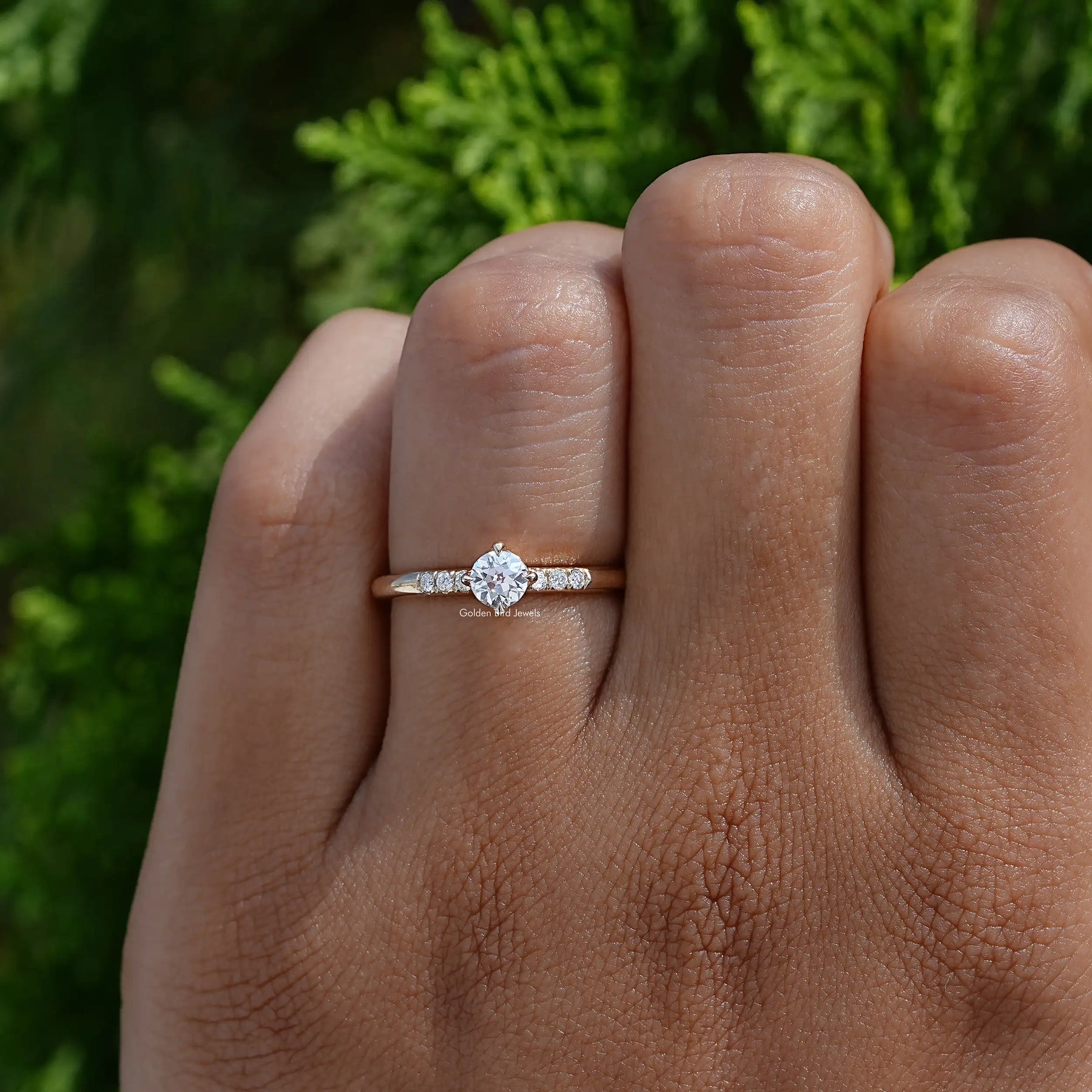 View of Round Cut Lab Diamond Accent Ring In two fingers