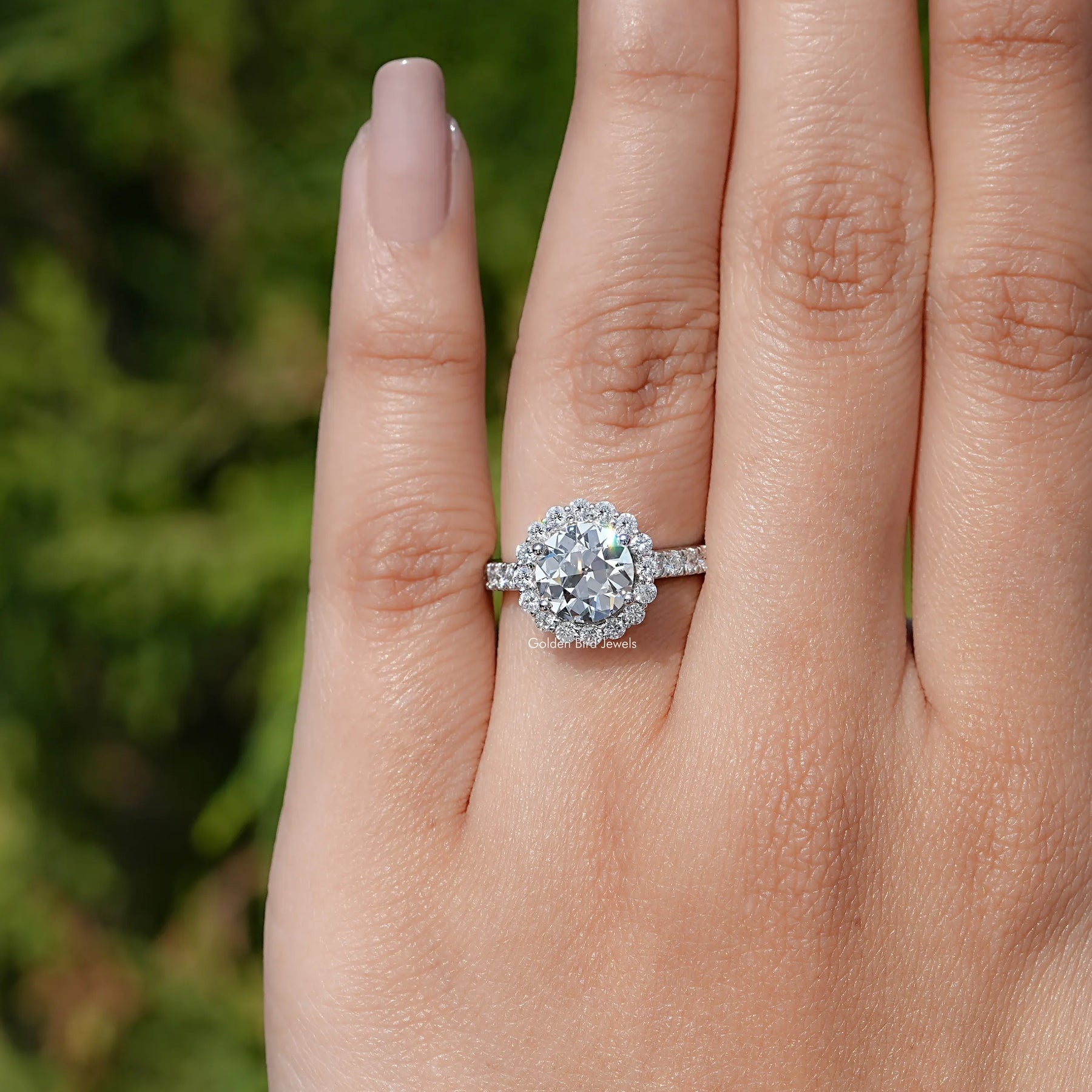 In finger view of Old European Round Lab Diamond Halo Accent Ring