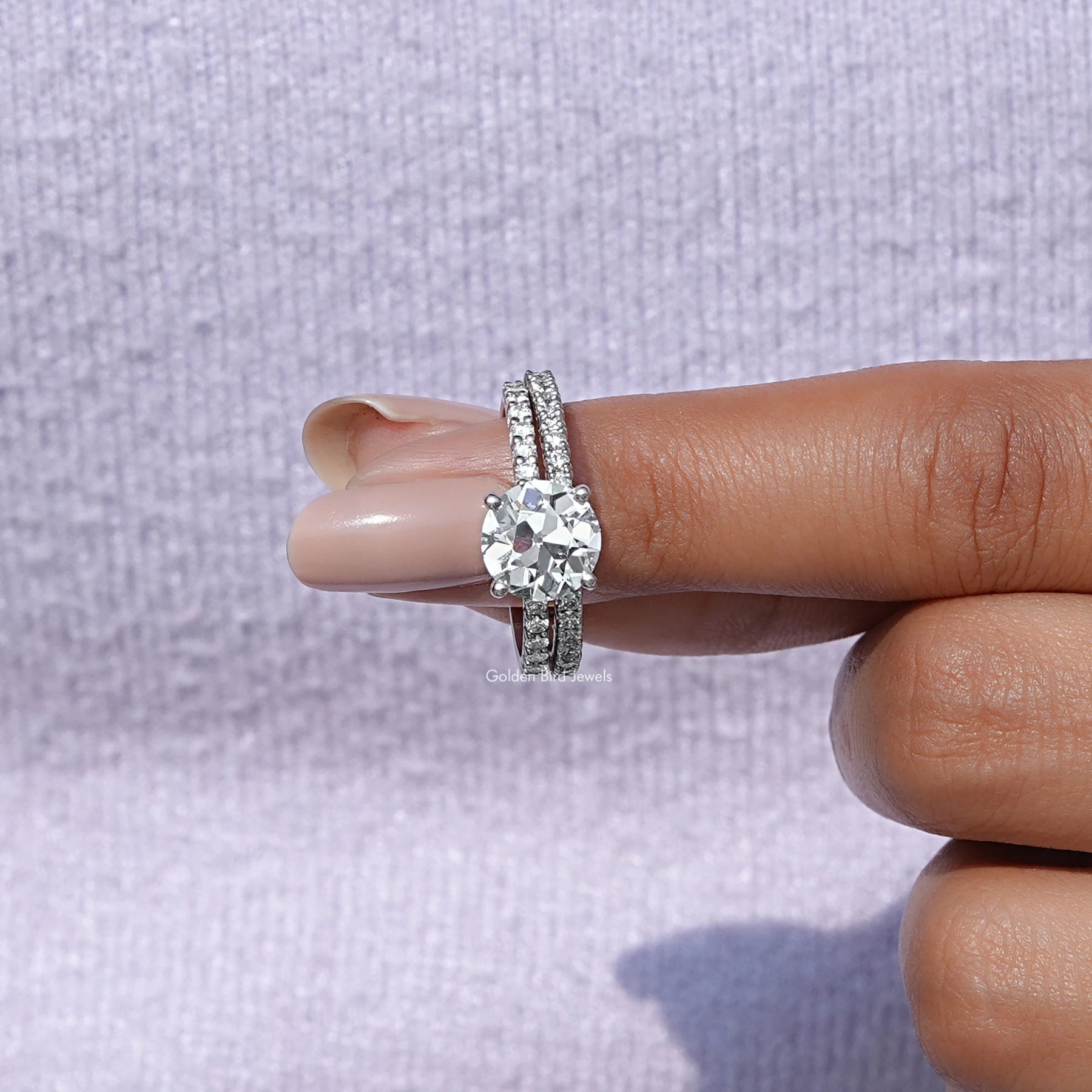 In finger front view of Old Round Cut Diamond Ring Set In White Gold