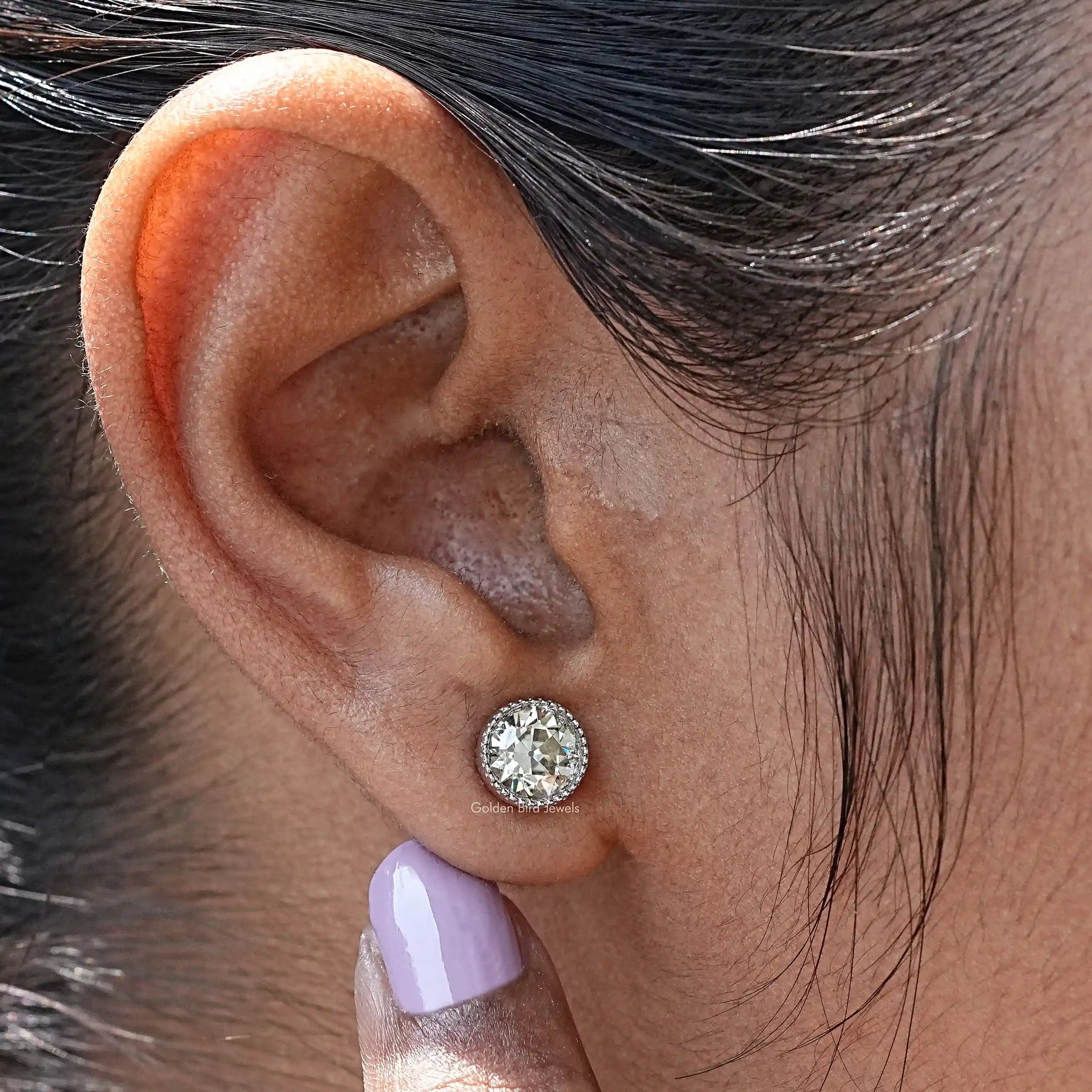 Detailed view of moissanite earrings in secure setting