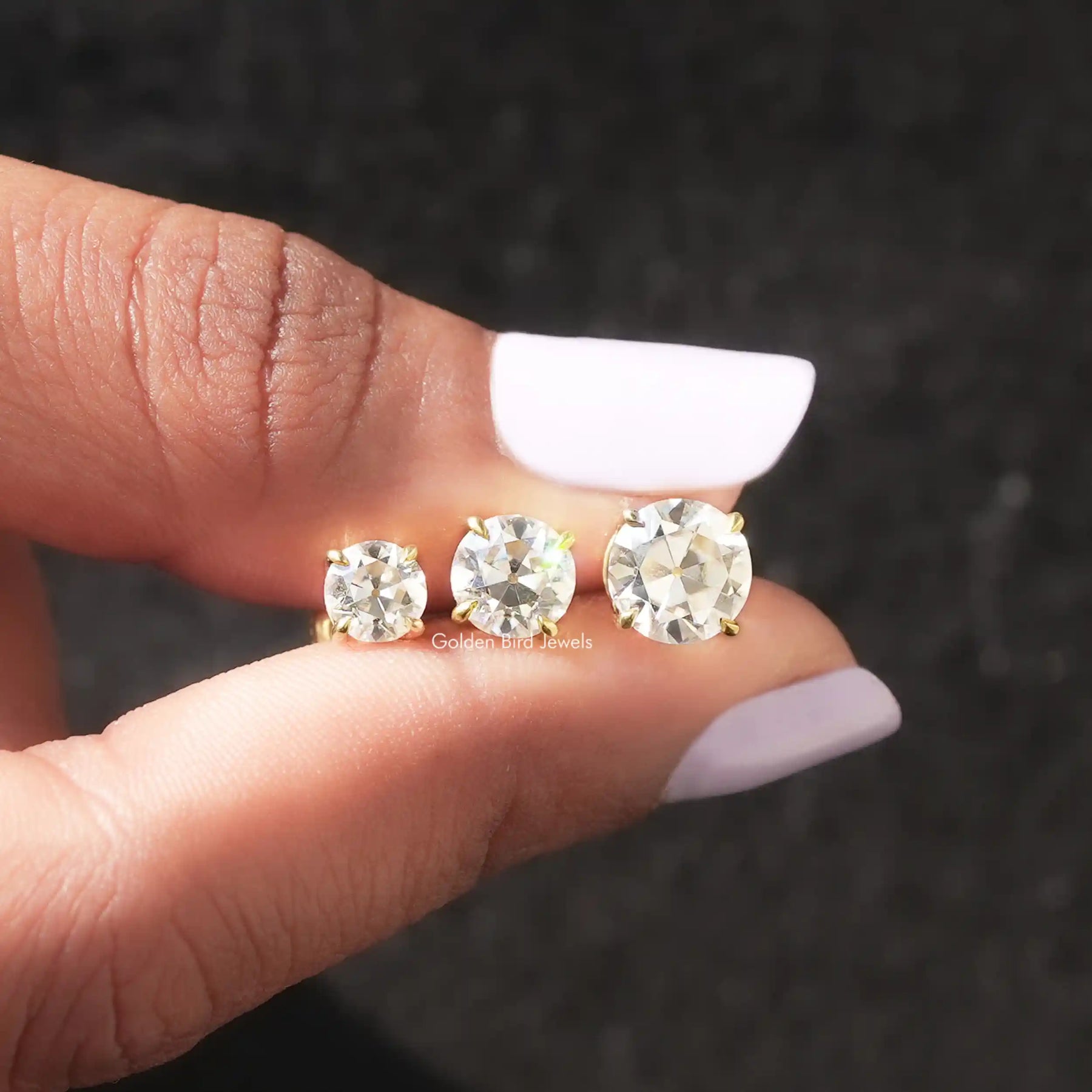 Top View of Old European round cut earrings in prongs setting