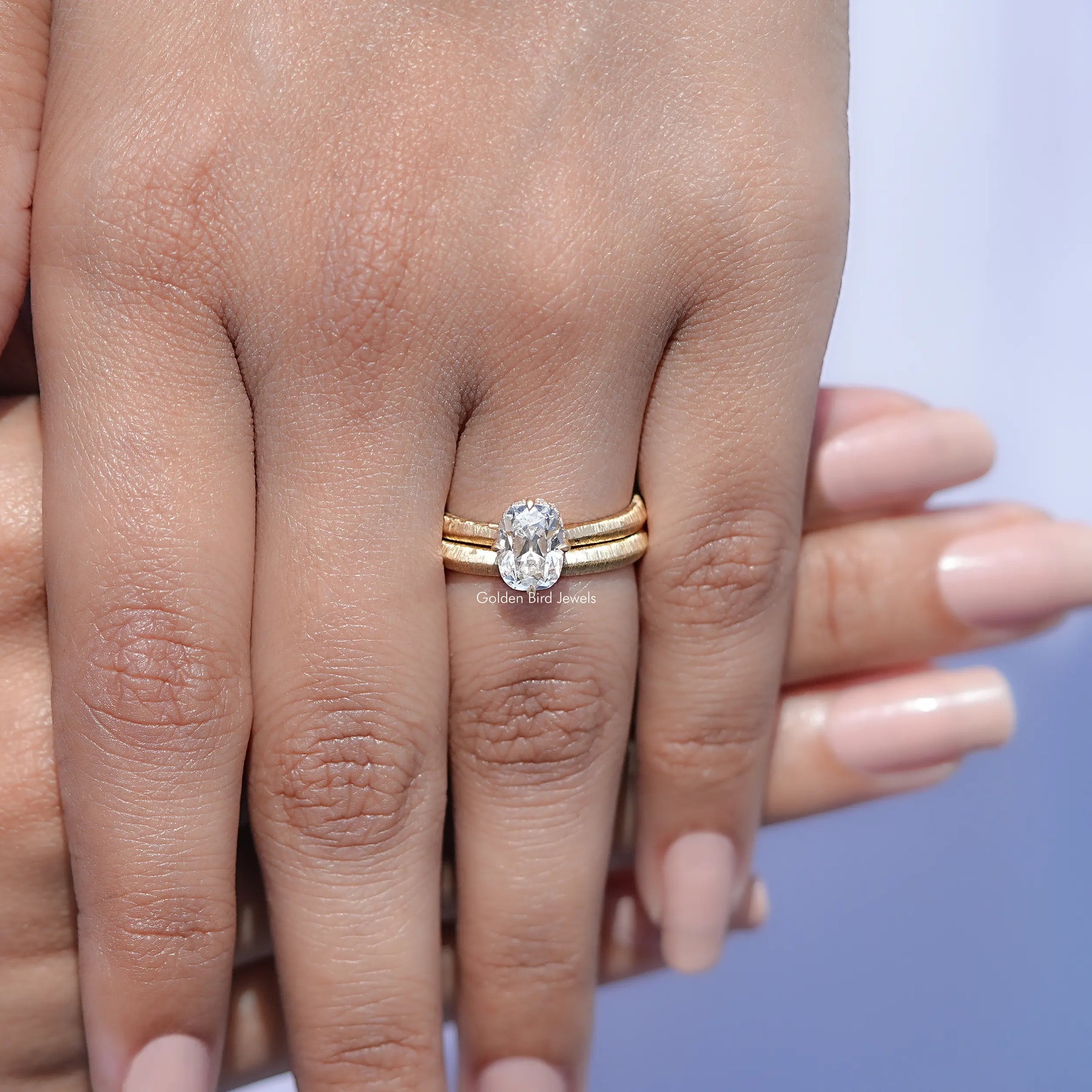 In hand Showing View Of Old Mine Cushion Cut Ring Set