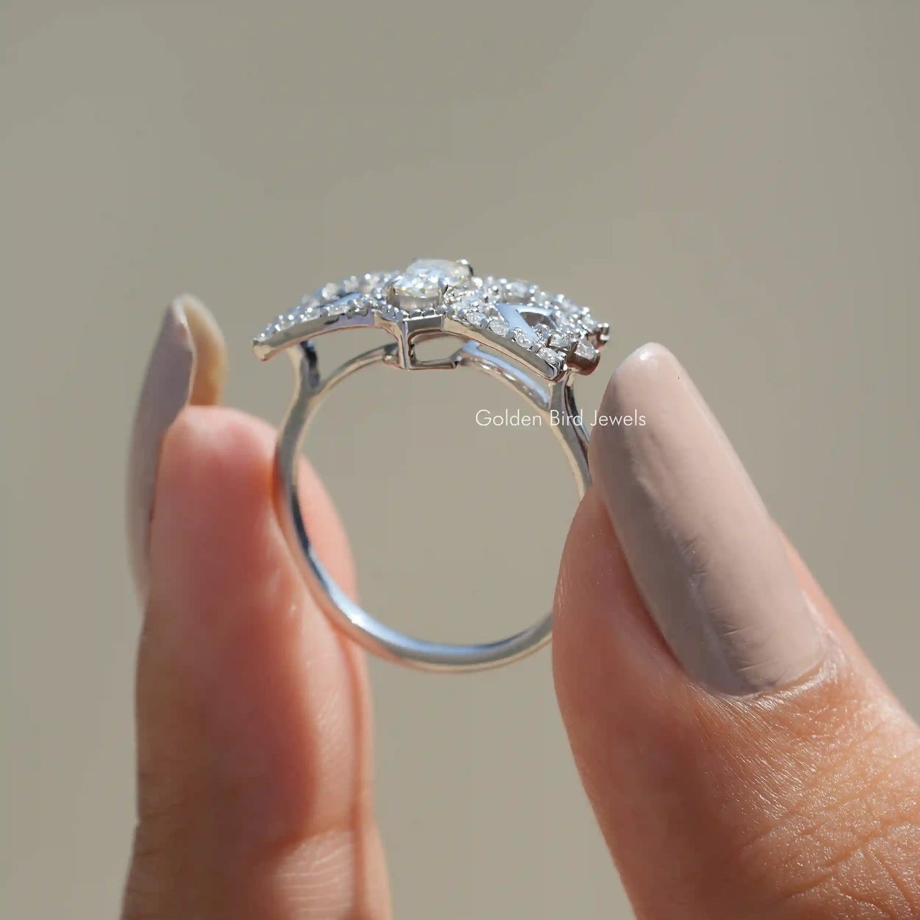 Back View of Old Mine Cushion Cut Moissanite Ring In two fingers