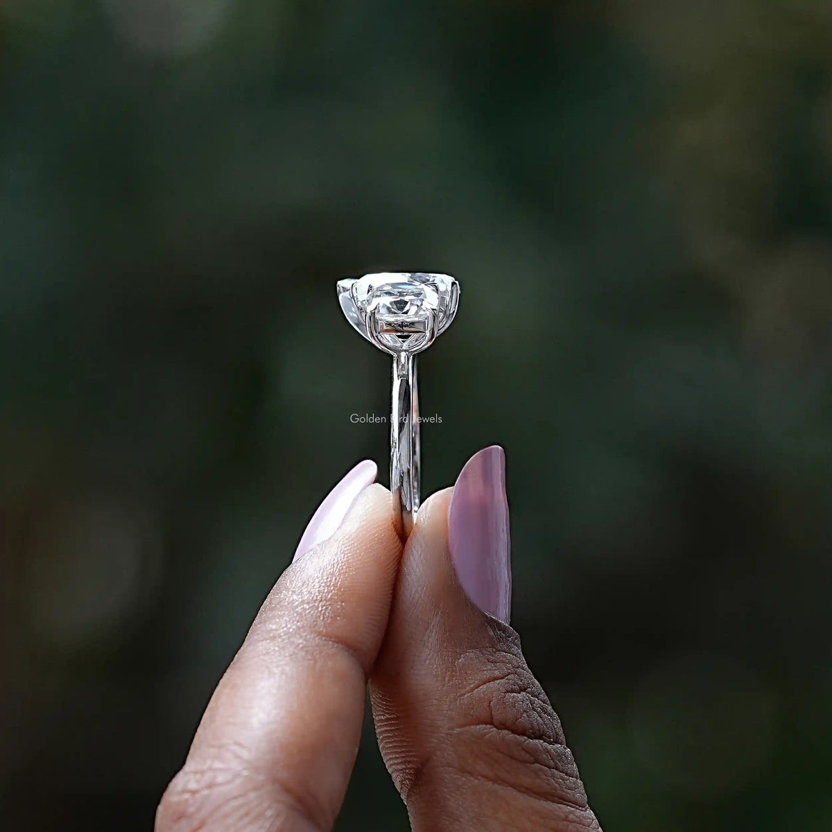 Side View of Old Mine Cushion Cut Moissanite Ring In two fingers