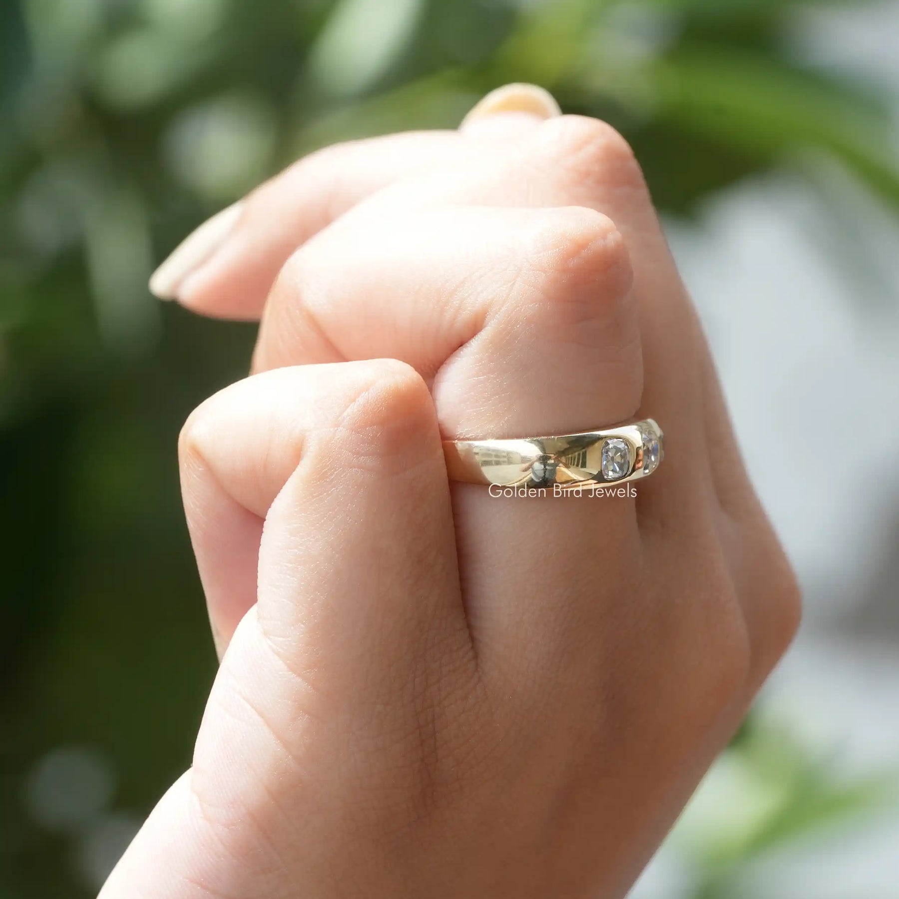 Side view of old mine cushion cut Ring in yellow gold