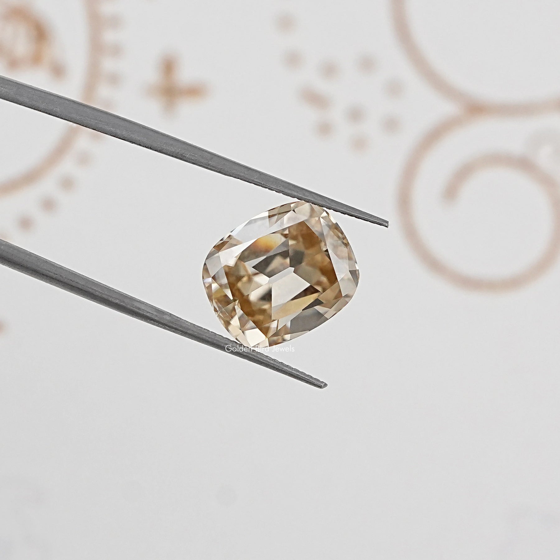 In Tweezer View Of yellow Old Mine Cushion Loose Moissanite Stone