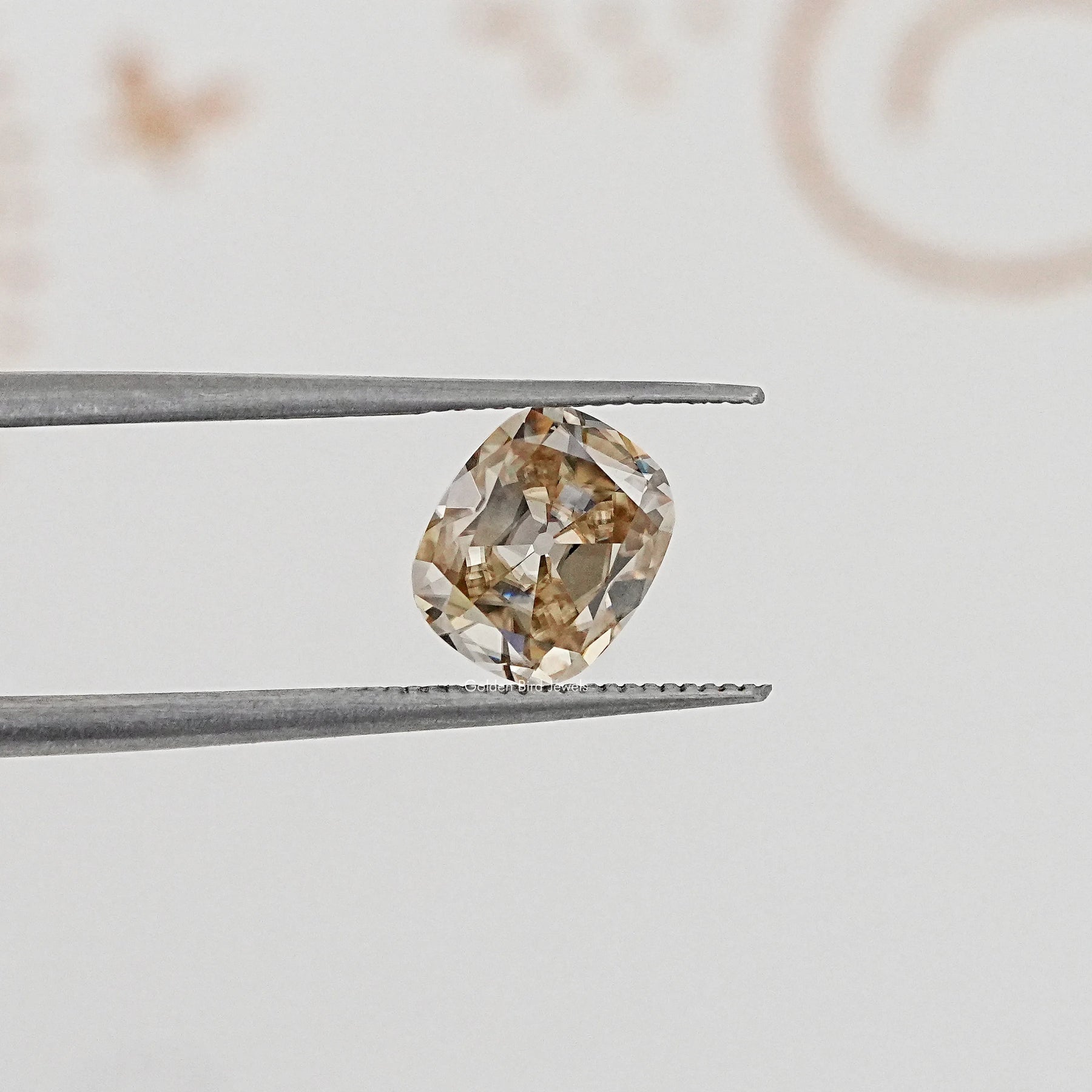 In Tweezer View Of Old Mine Cushion Cut Loose Moissanite Stone