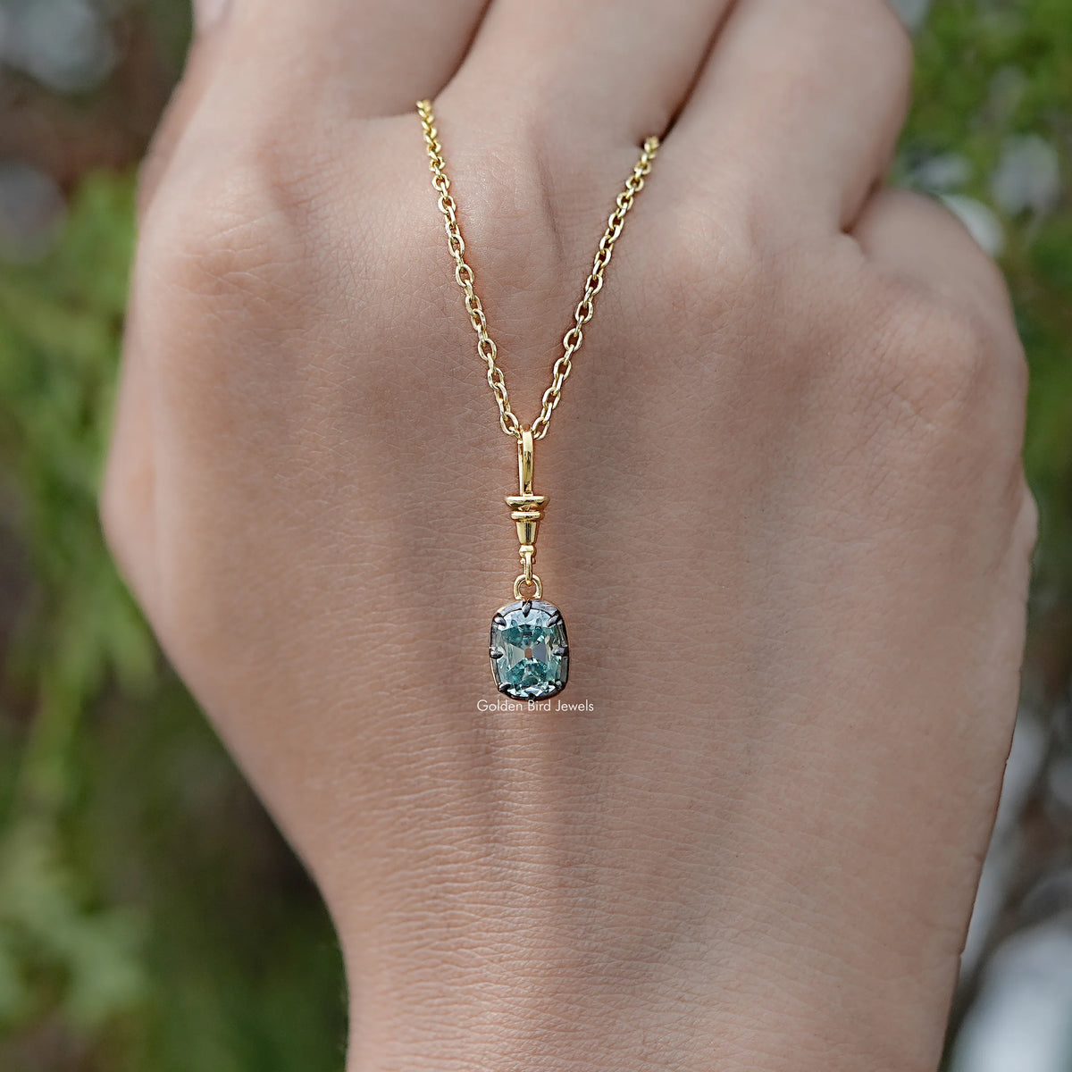 In hand Showing View Of Old Mine Cushion Moissanite Pendant