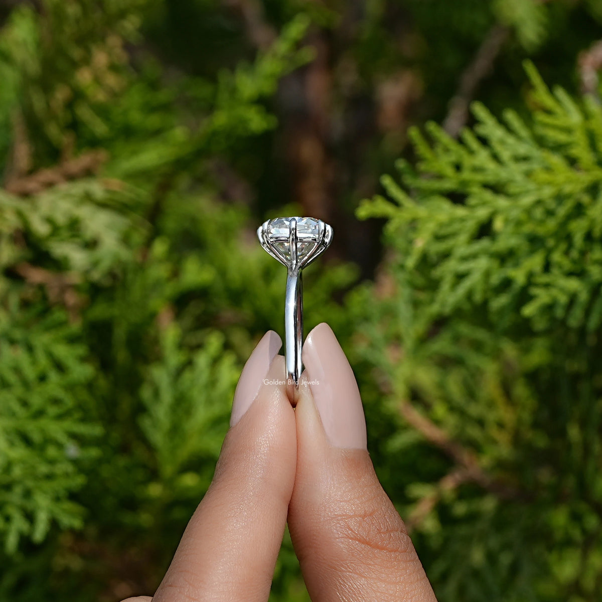 Side View of Old Mine Cushion Cut Moissanite Ring In two fingers