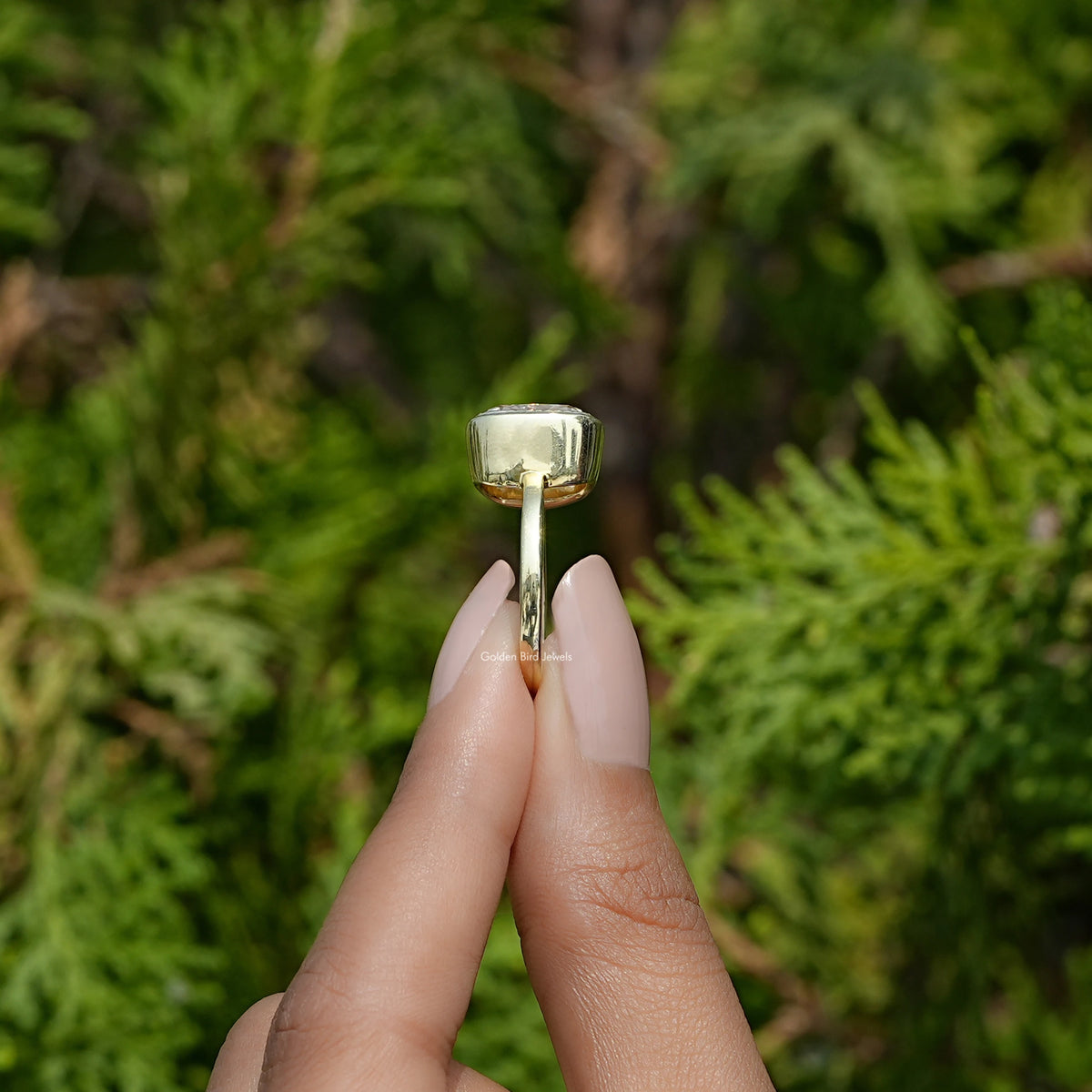 Side View of Old Mine Cushion Cut Moissanite Ring In two fingers