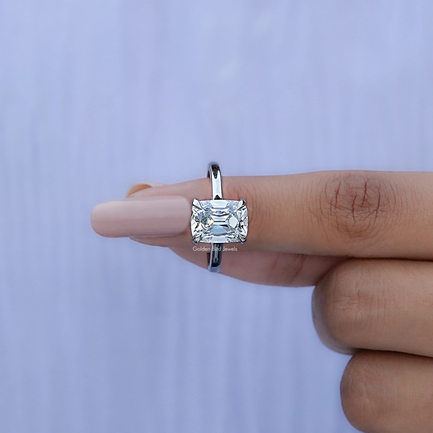 In finger front View of Old Mine Elongated Cushion Cut Halo Diamond Ring In White Gold