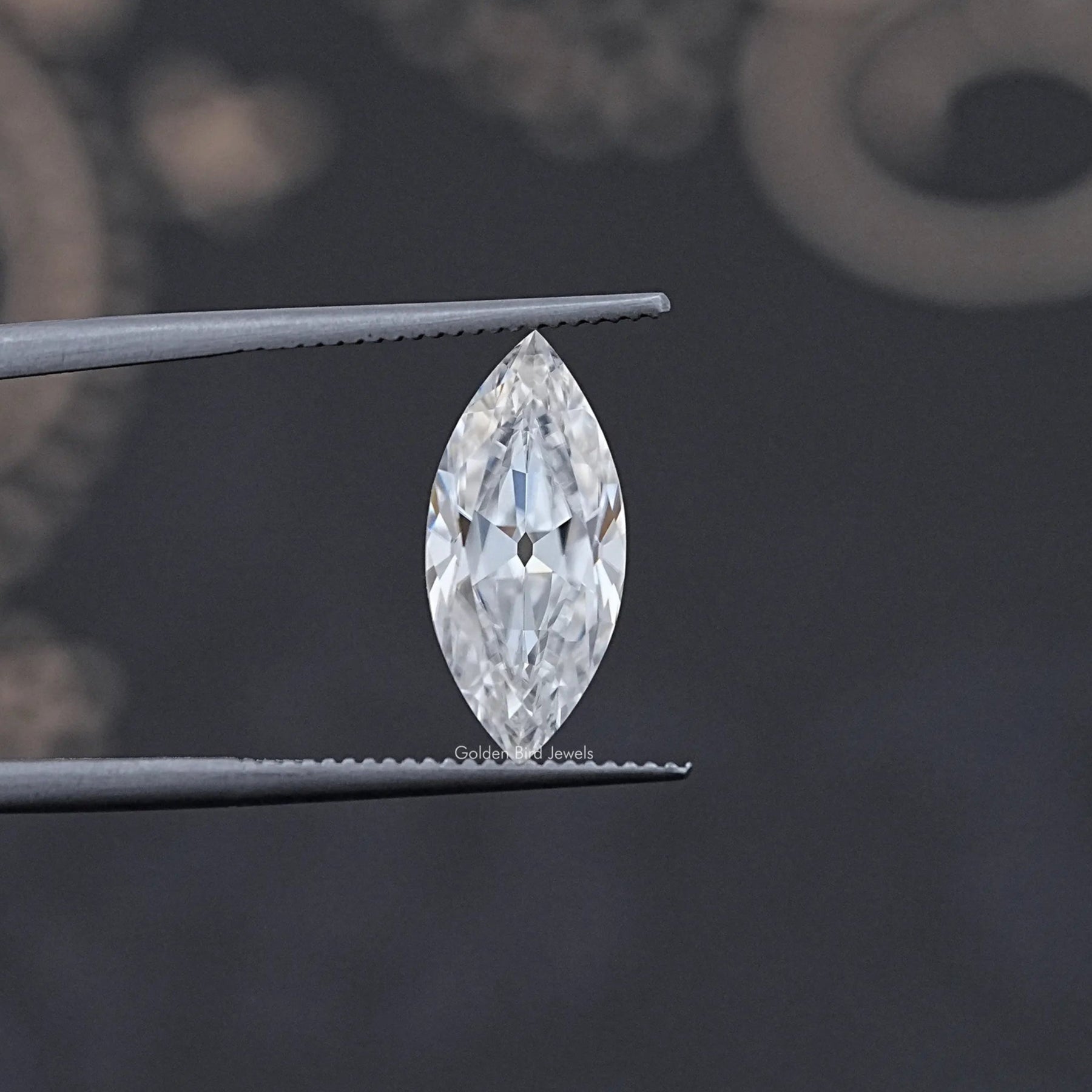 In Tweezer View Of Old Mine Marquise Cut Moissanite Loose Stone
