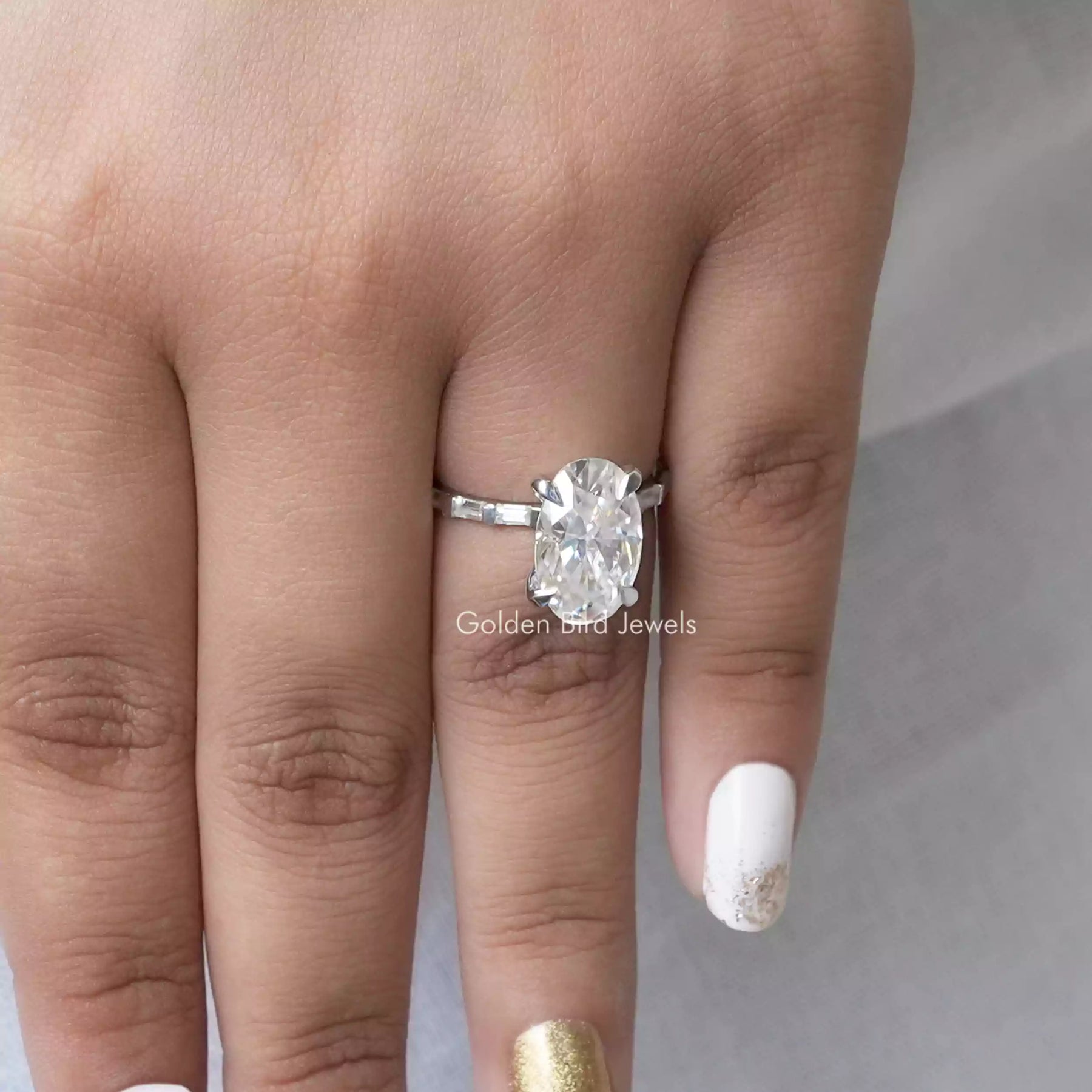 Moissanite Oval Cut Ring Made Of Baguette Cut Side Stones In finger