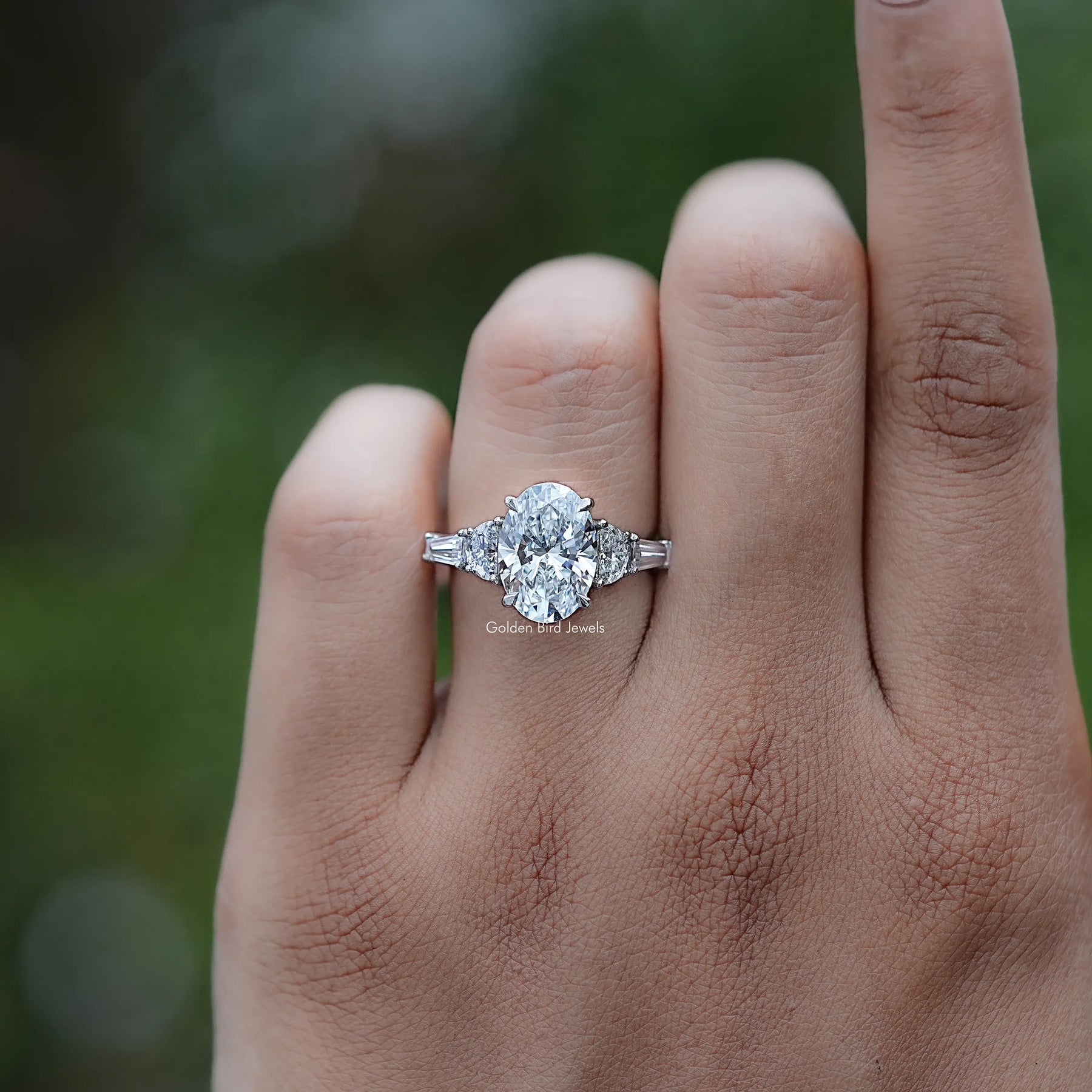 Front view of Oval And Half Moon Diamond Five Stone Ring