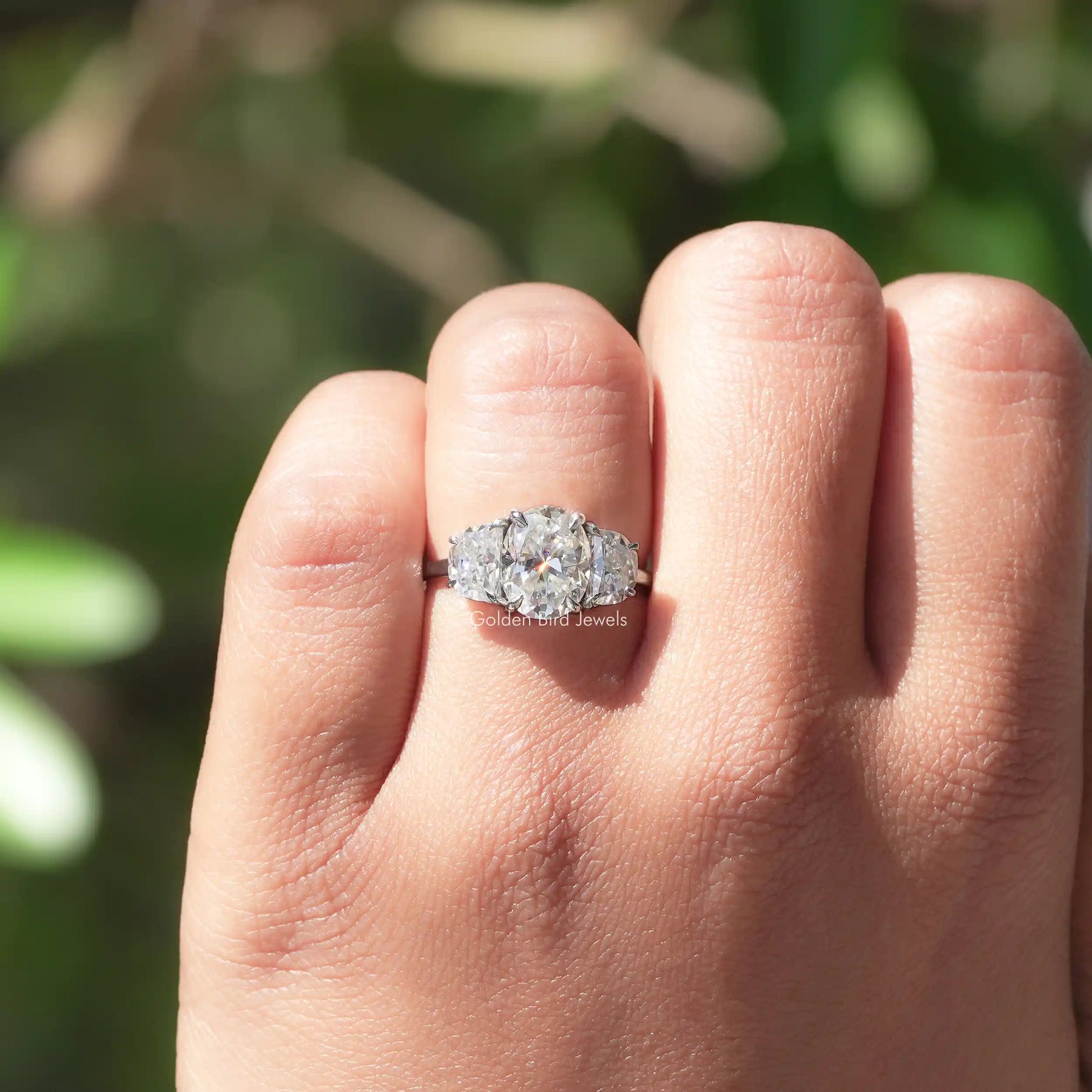 View of Oval Cut Three Stone Ring In White Gold