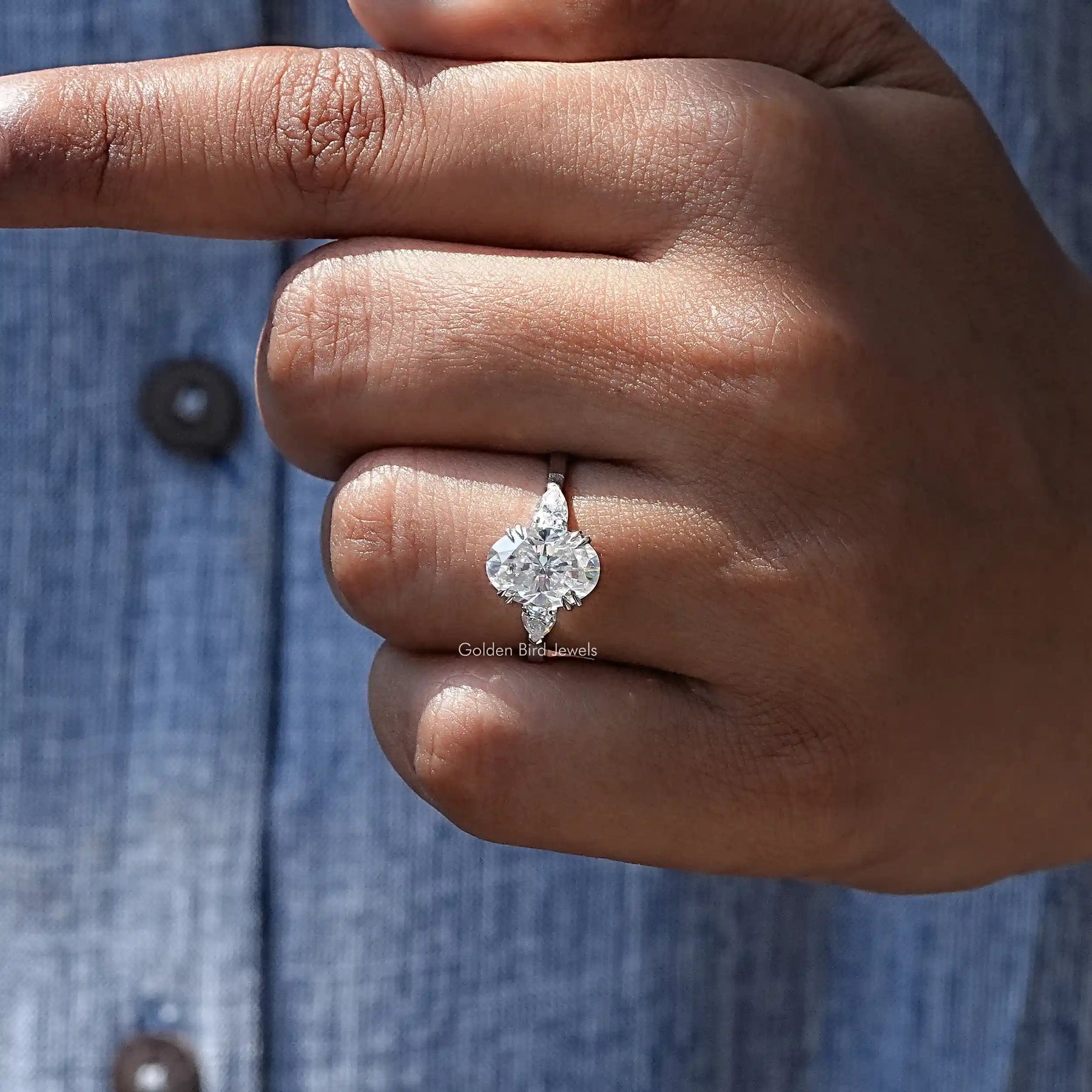 Close-Up View of Oval And Pear Cut Moissanite Ring In White Gold