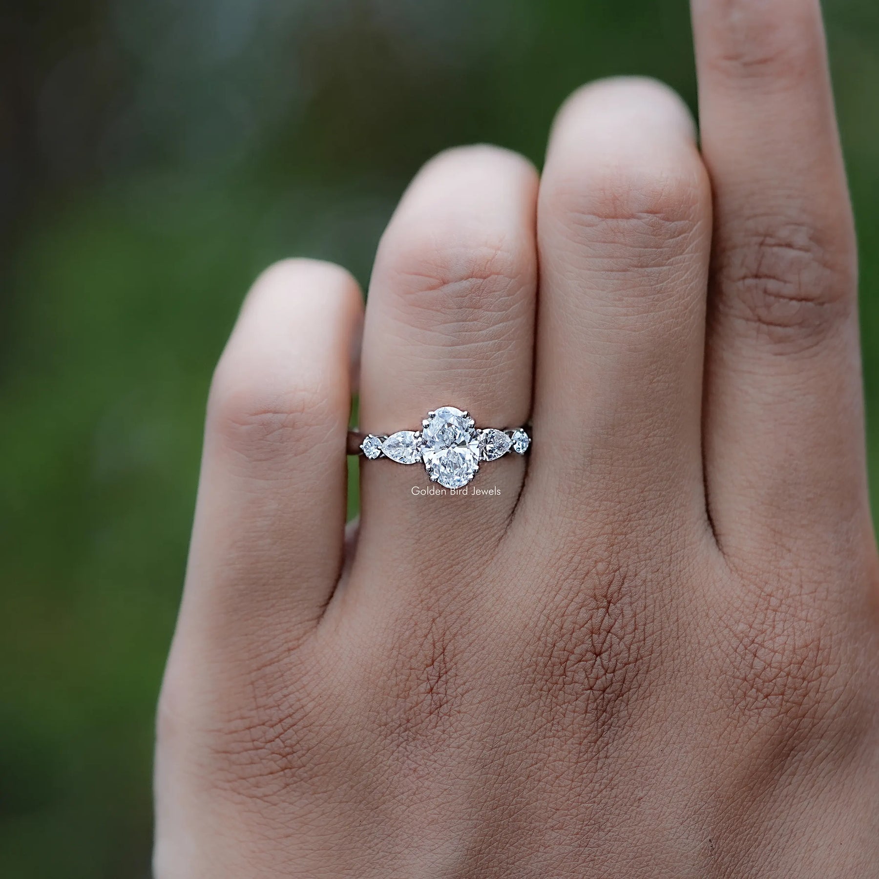 Front view of Oval And Half Moon Diamond Five Stone Ring