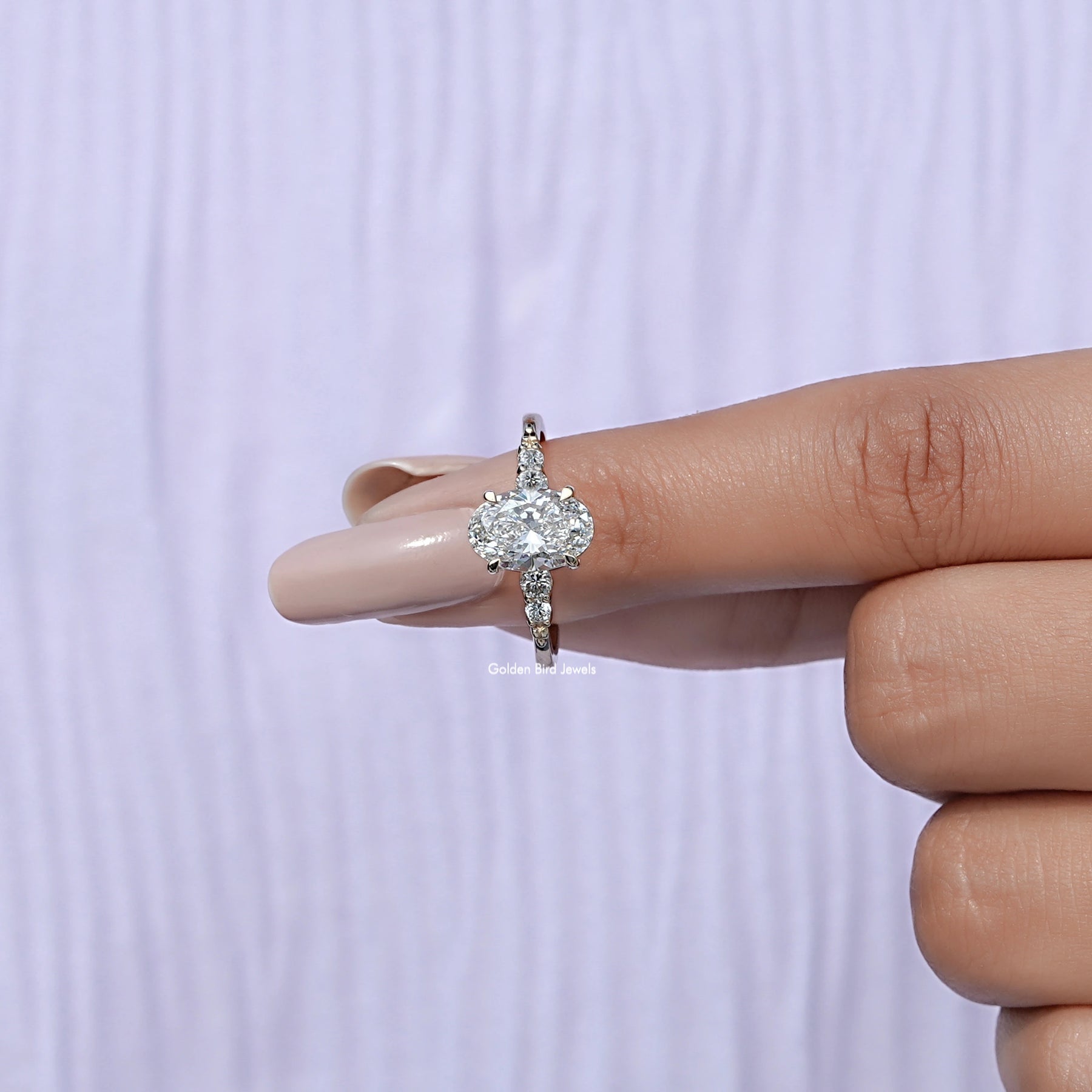 In finger front View of Oval And Round Cut Lab Diamond Five Stone Ring In White Gold