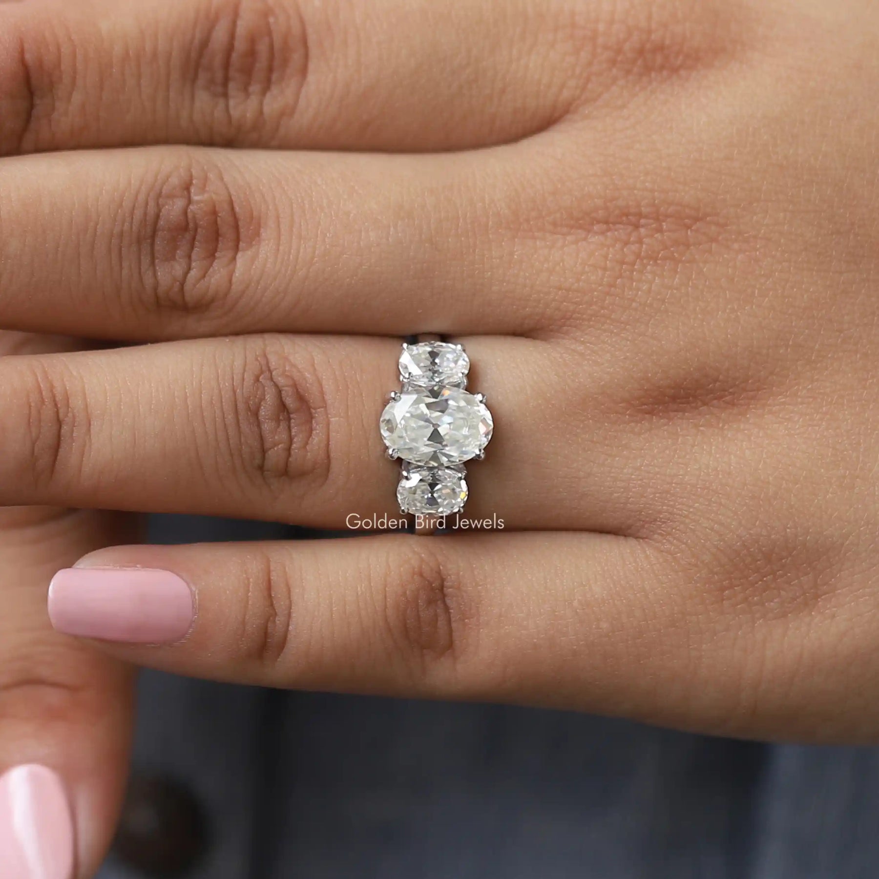 Detailed View Of Oval Cut Three Stone Engagement Ring in White Gold