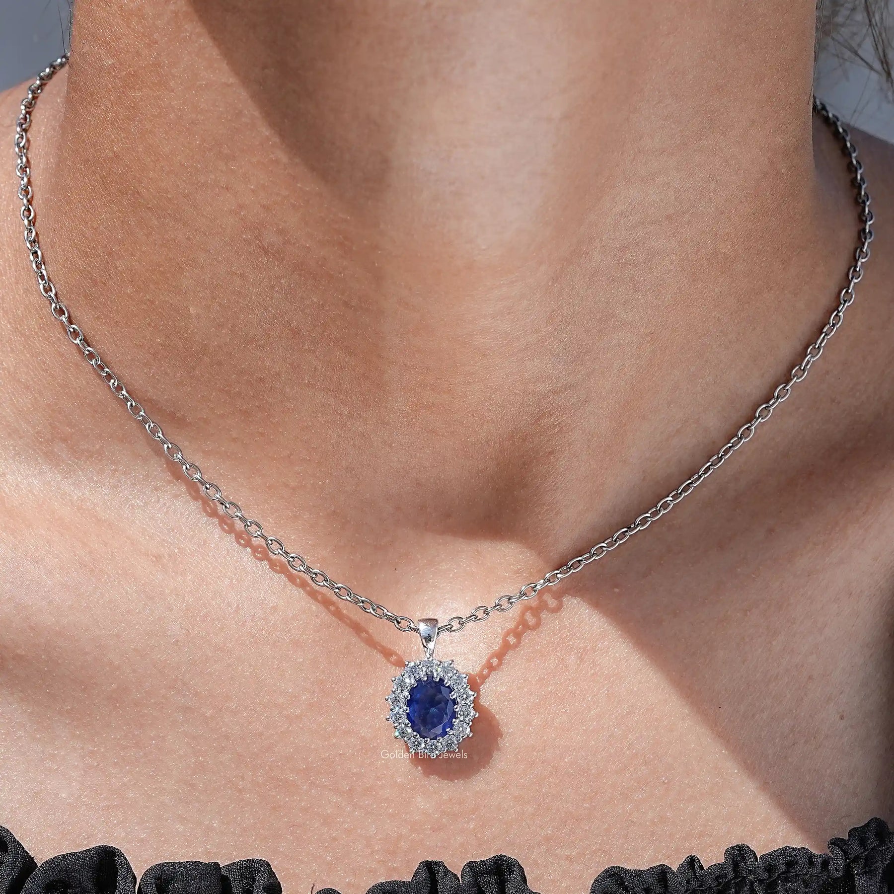 View of lab grown gemestone oval cut halo pendant