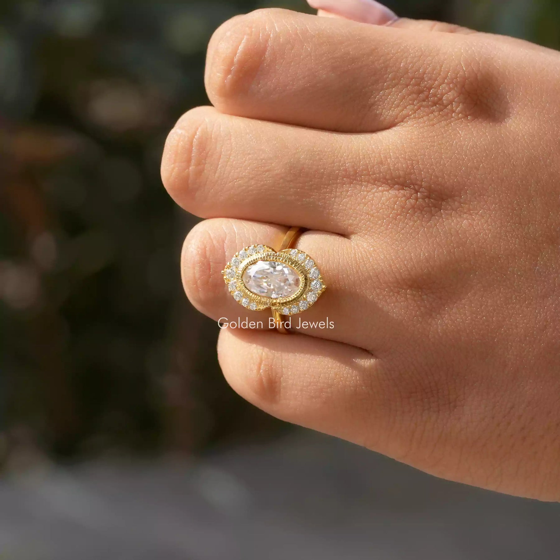 Oval Cut Halo Moissanite Engagement Ring In Yellow Gold