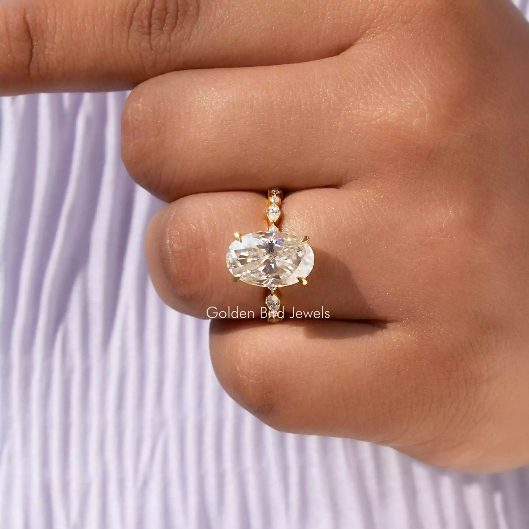 Detailed View Of Moissanite Oval Cut Hidden Halo Ring In Yellow Gold