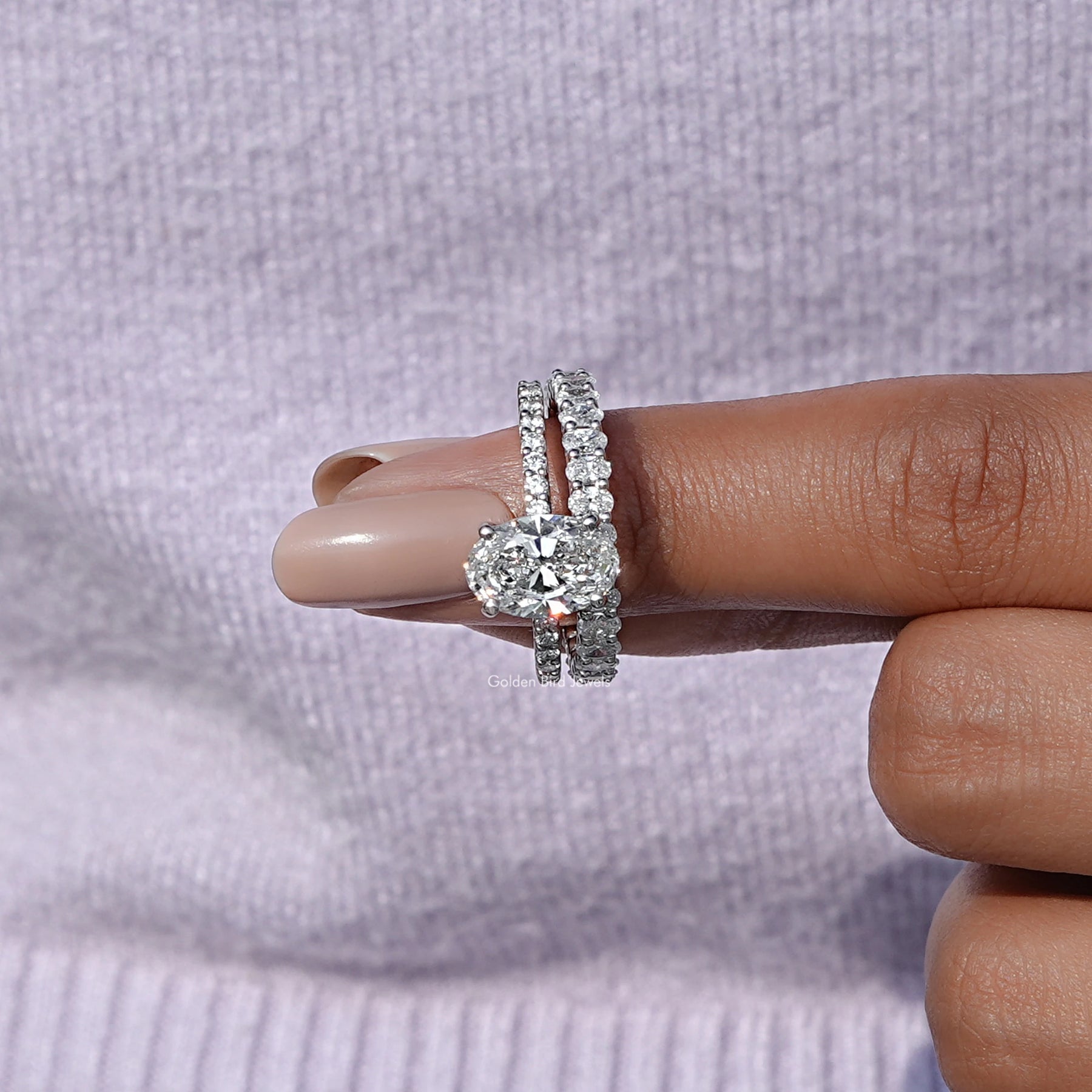 In finger front view of Lab Grown Oval Cut Wedding Band