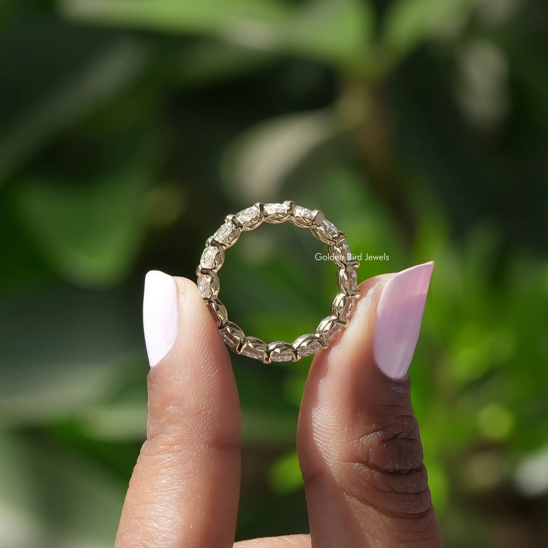 Back View of Oval Cut Lab Grown Diamond Eternity Wedding Band In two fingers