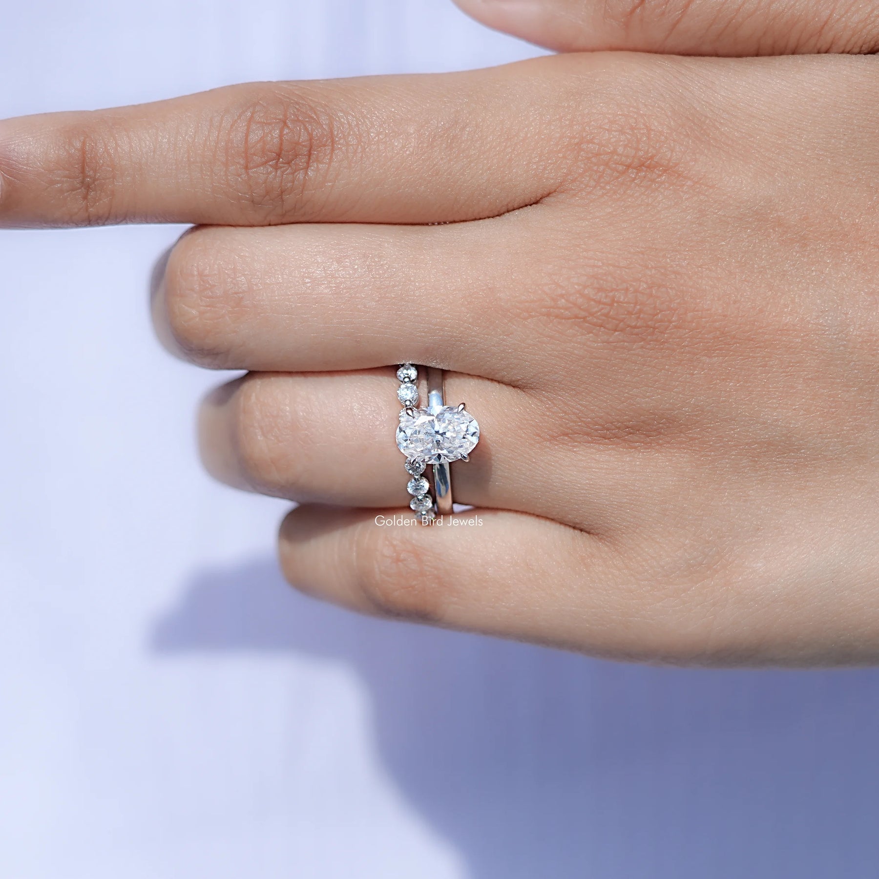 View of solitaire Oval Moissanite ring in prongs setting
