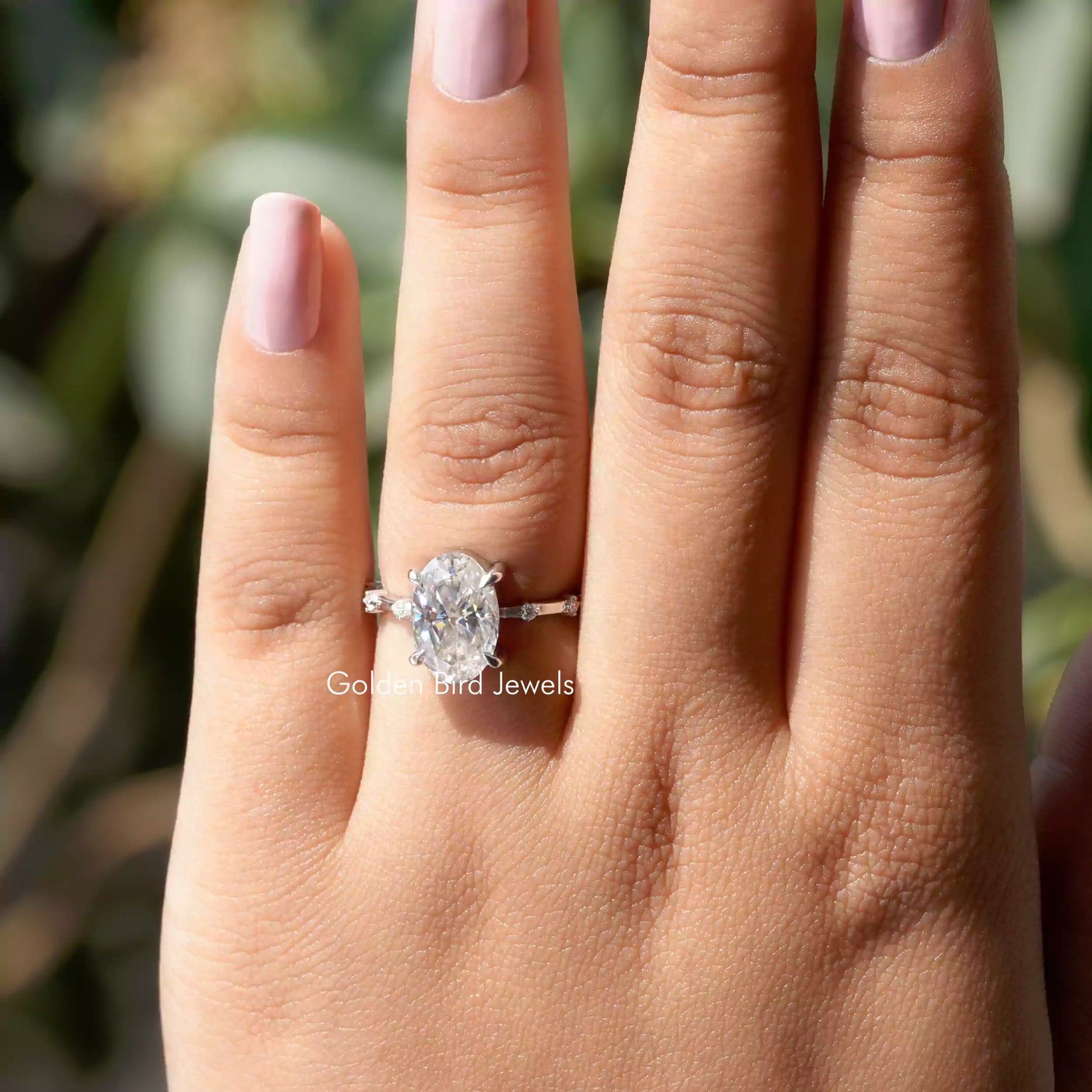 Close-Up View of Oval Cut Moissanite Engagement Ring In White Gold