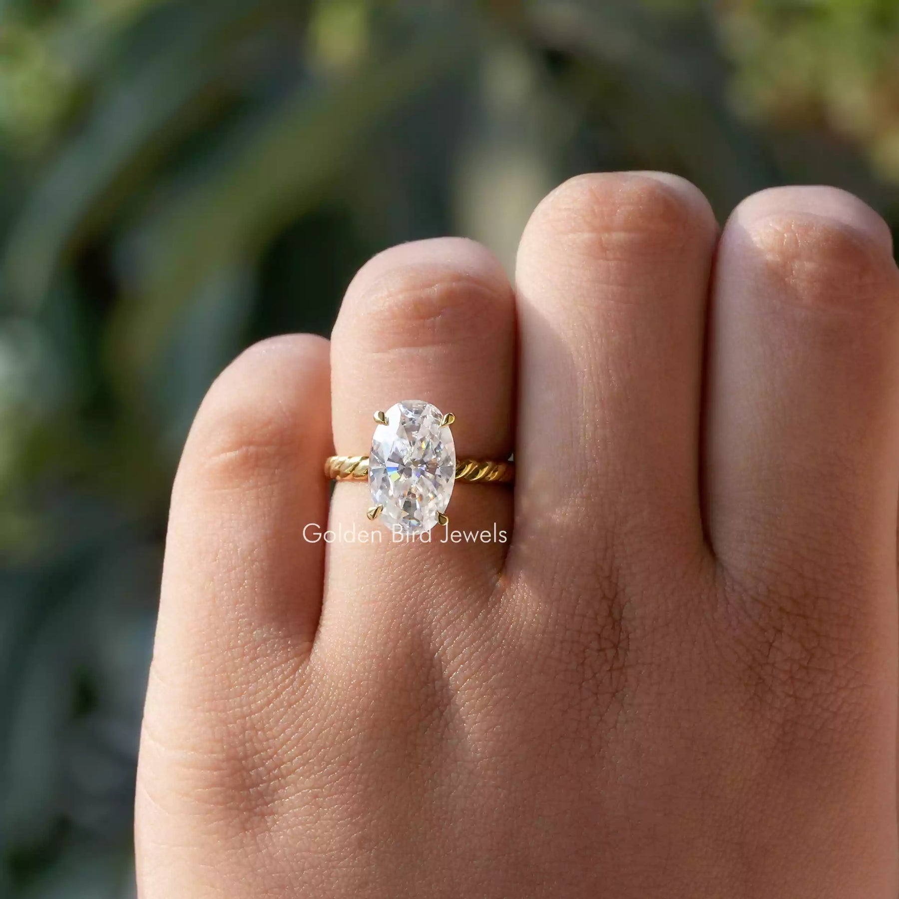 View of Solitaire Crushed Ice Oval Moissanite Engagement Ring In finger