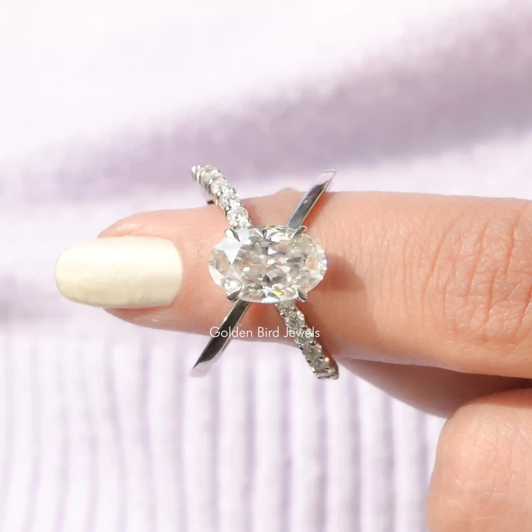 In finger front View of Oval Cut Split Shank Moissanite Ring