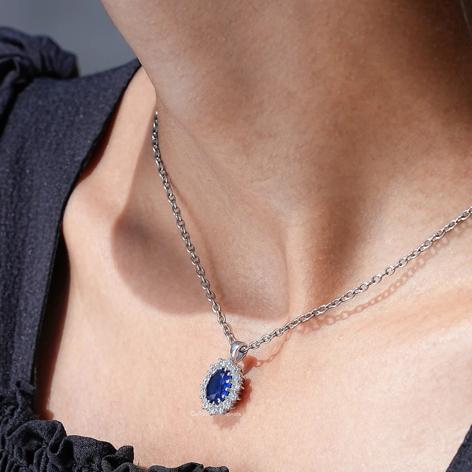 In neck view of lab grown gemstone oval cut halo pendant