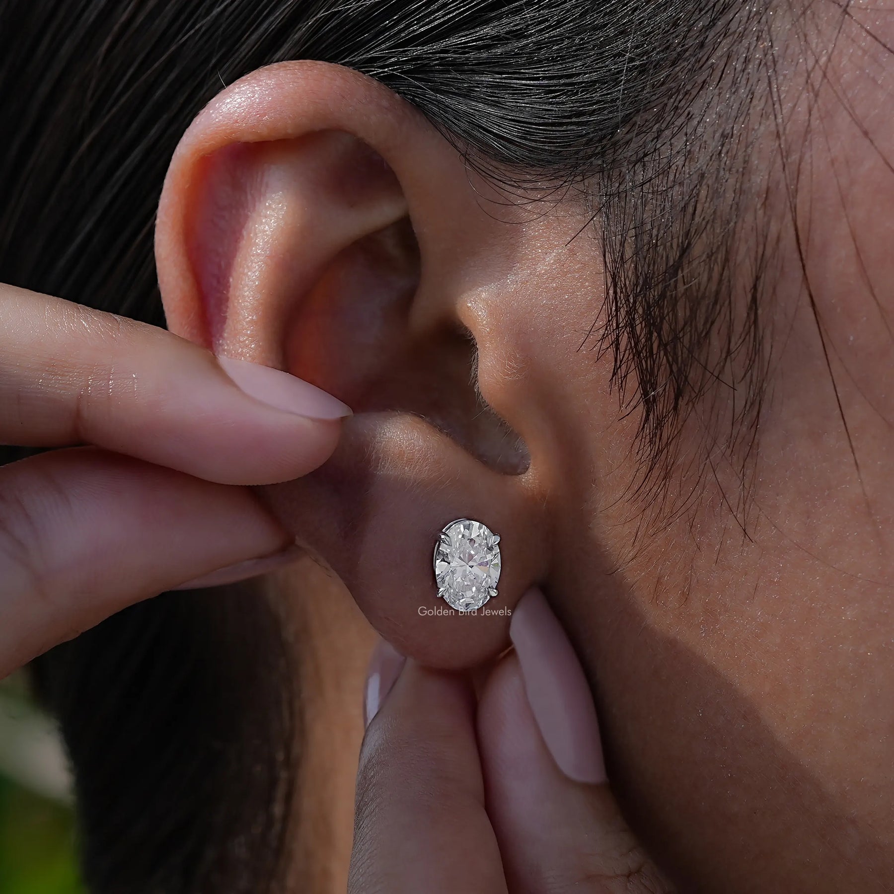 Close view of oval shaped earrings in a Unique design