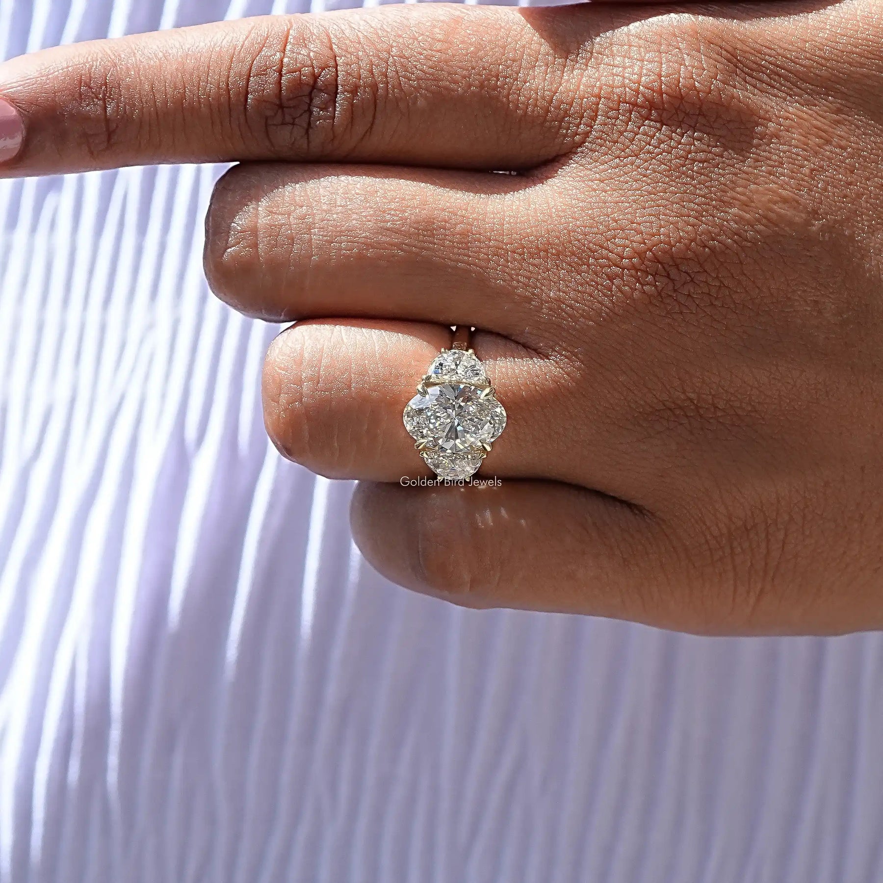 View of Oval Cut Diamond Accent Halo Wedding Ring in prongs setting