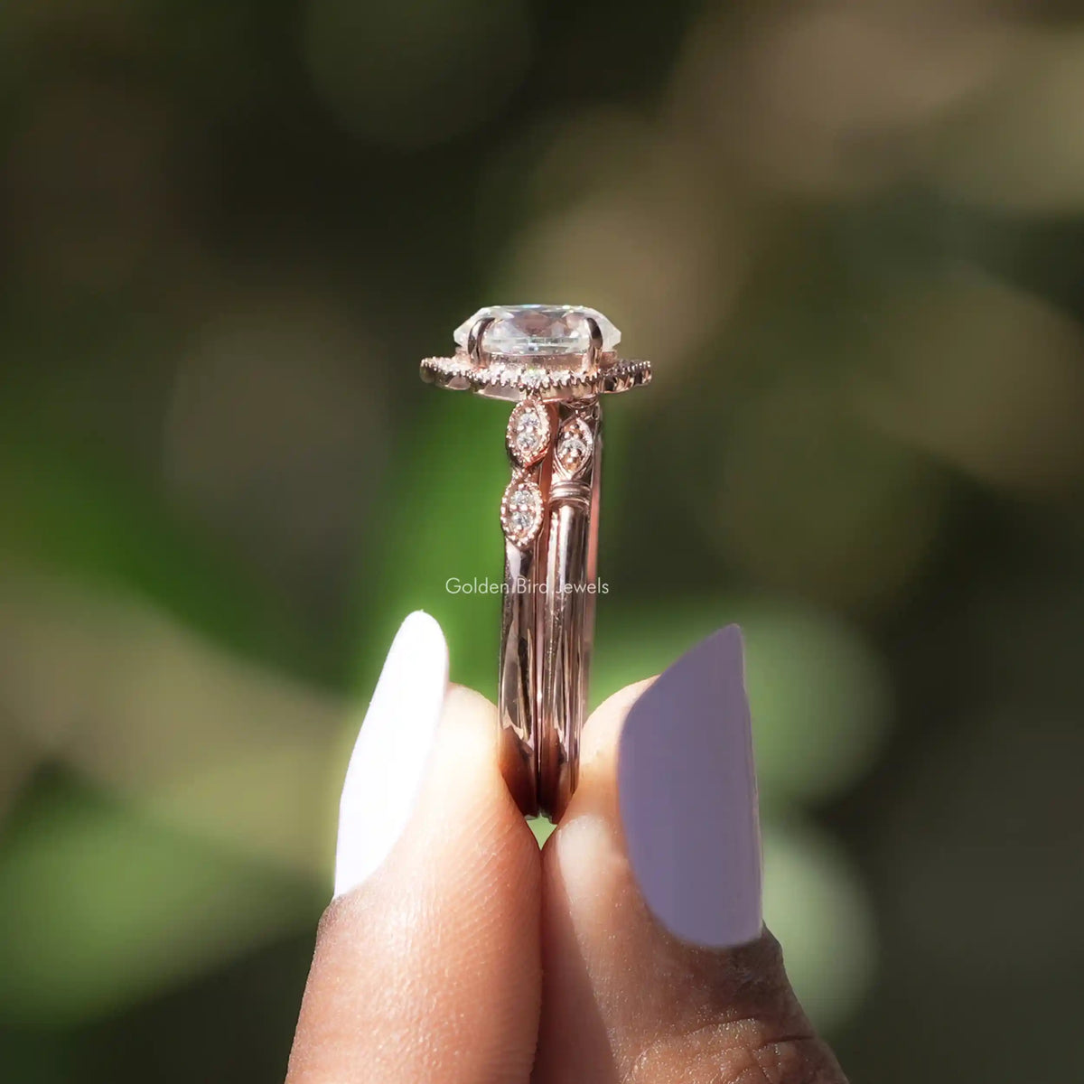 Side View of Oval Cut Halo Moissanite Ring In two fingers