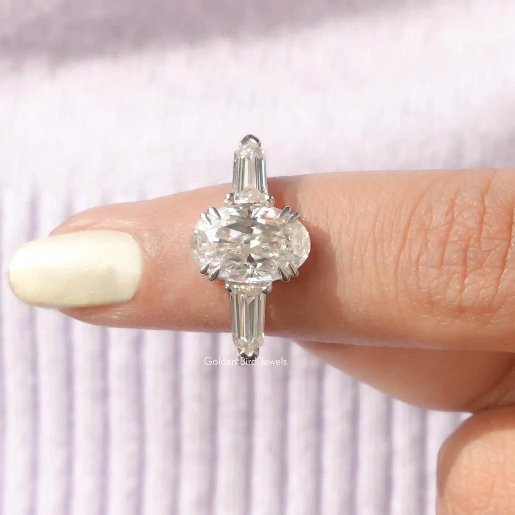 In finger front View of Oval Cut Moissanite Three Stone Ring