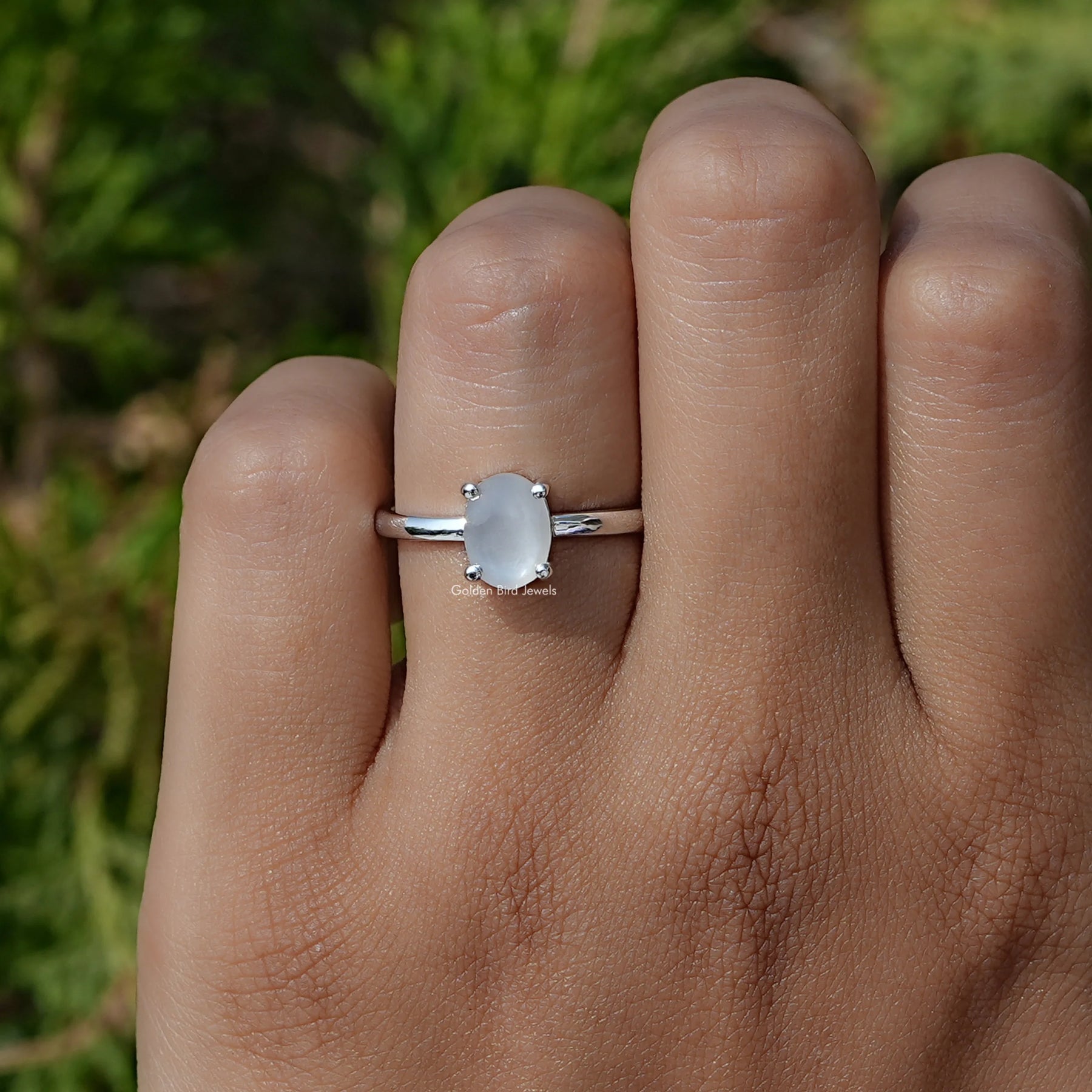 View of oval moonstone gemstone solitaire engagement ring In White Gold
