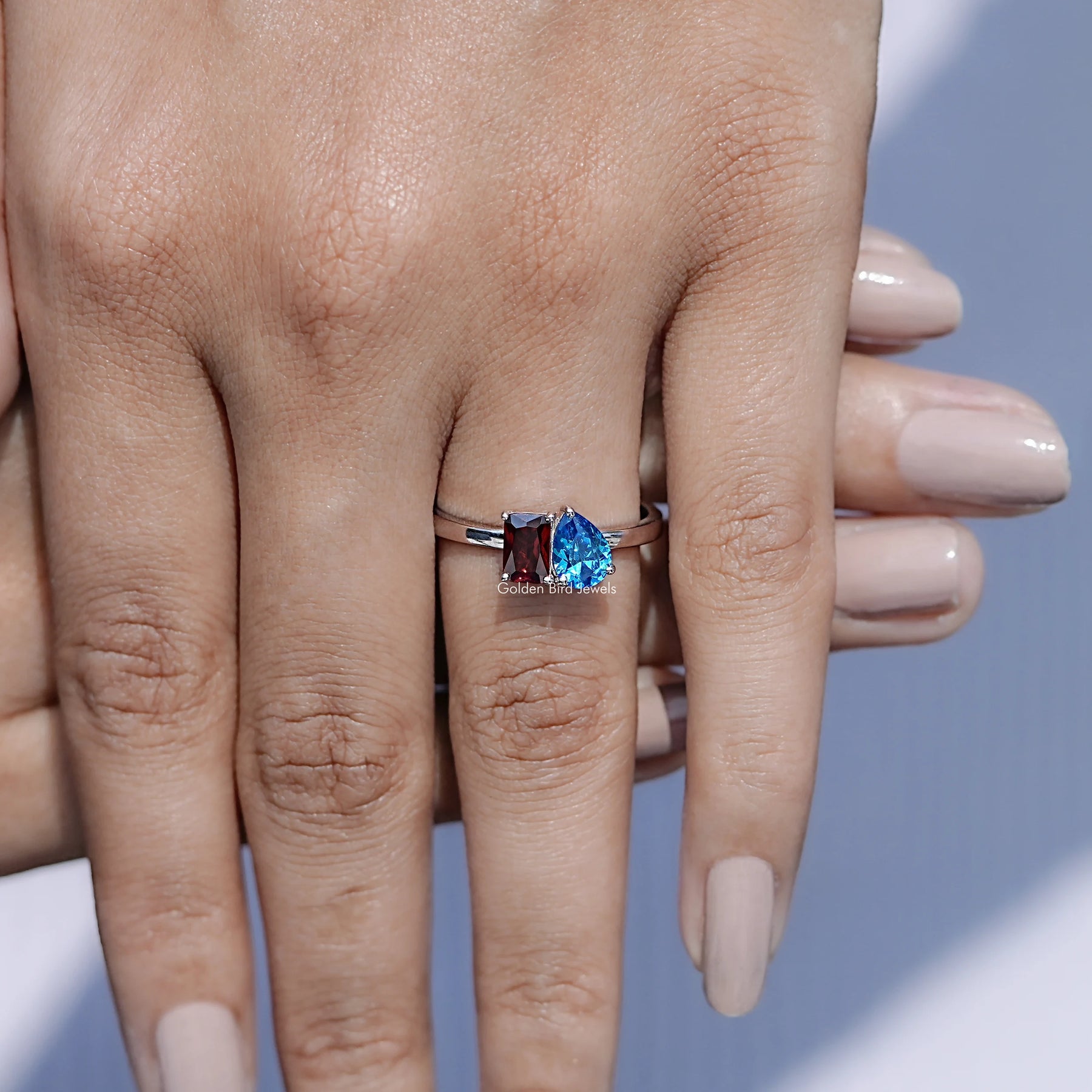 In finger front view of Two Stone Moissanite Engagement Ring in unique shape