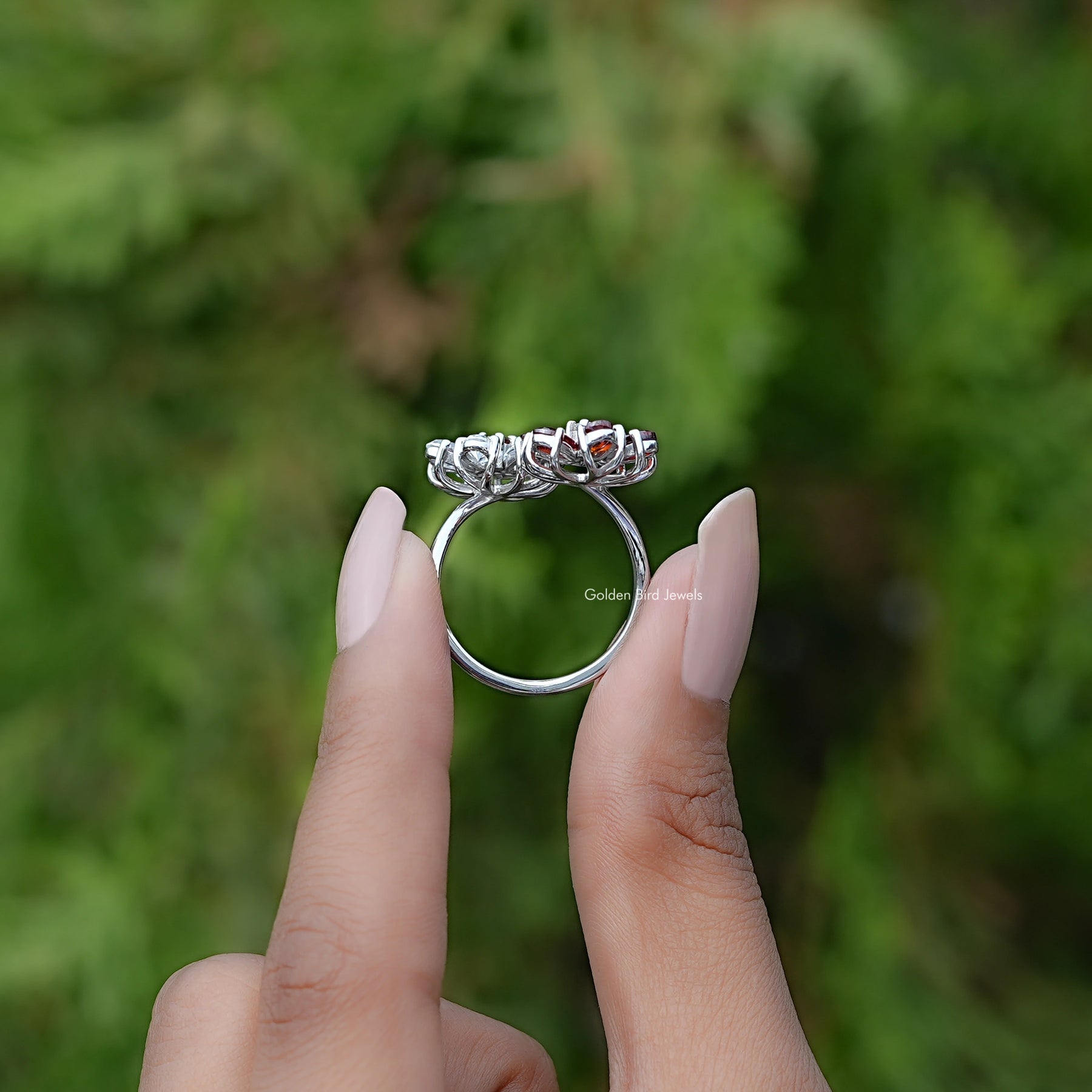 Back View of Pear Cut Gemstone Cluster Bypass Ring In two fingers