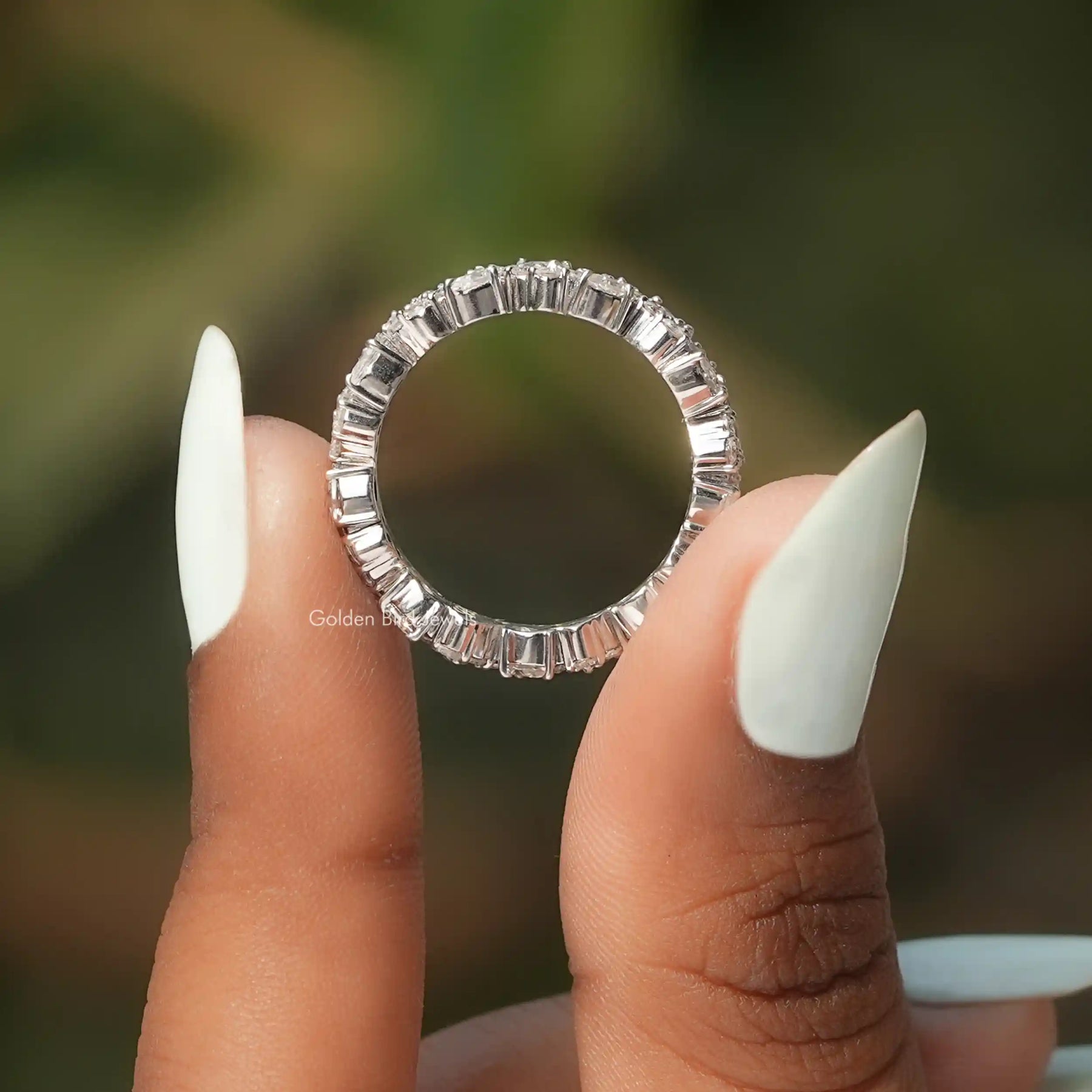 Back view of Pear Shaped Solitaire Moissanite Ring Set in secure setting